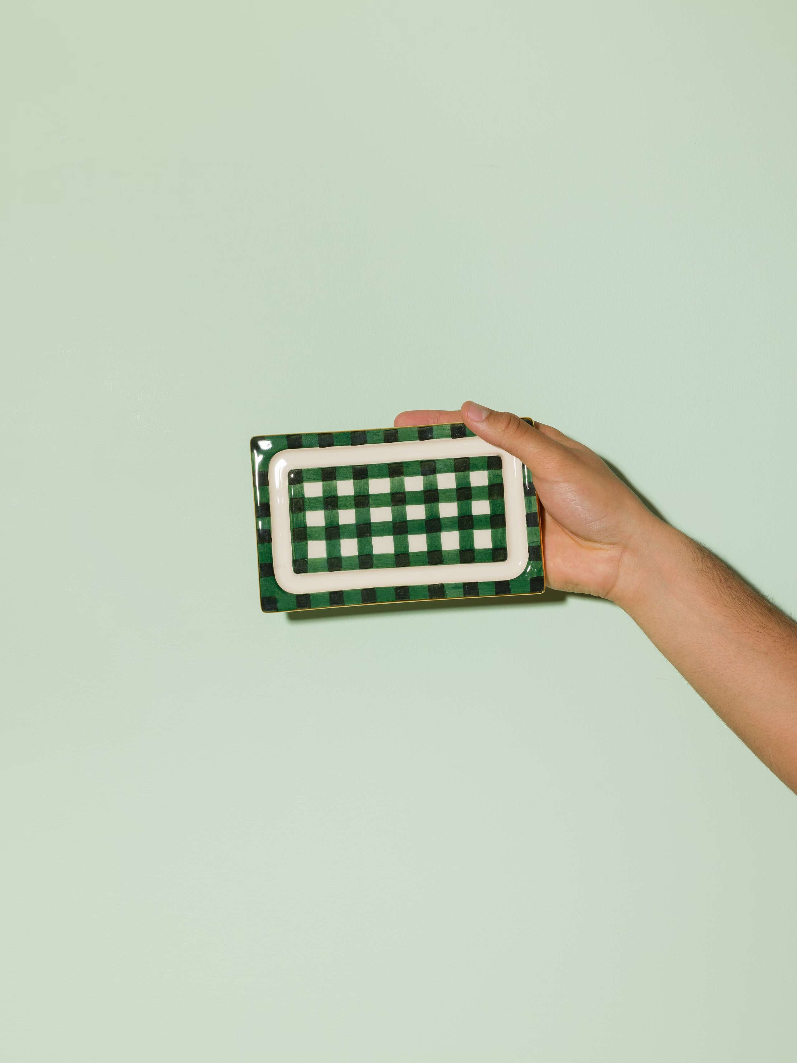 Picture of a beautiful handmade ceramic butter plate featuring a green vichy check pattern