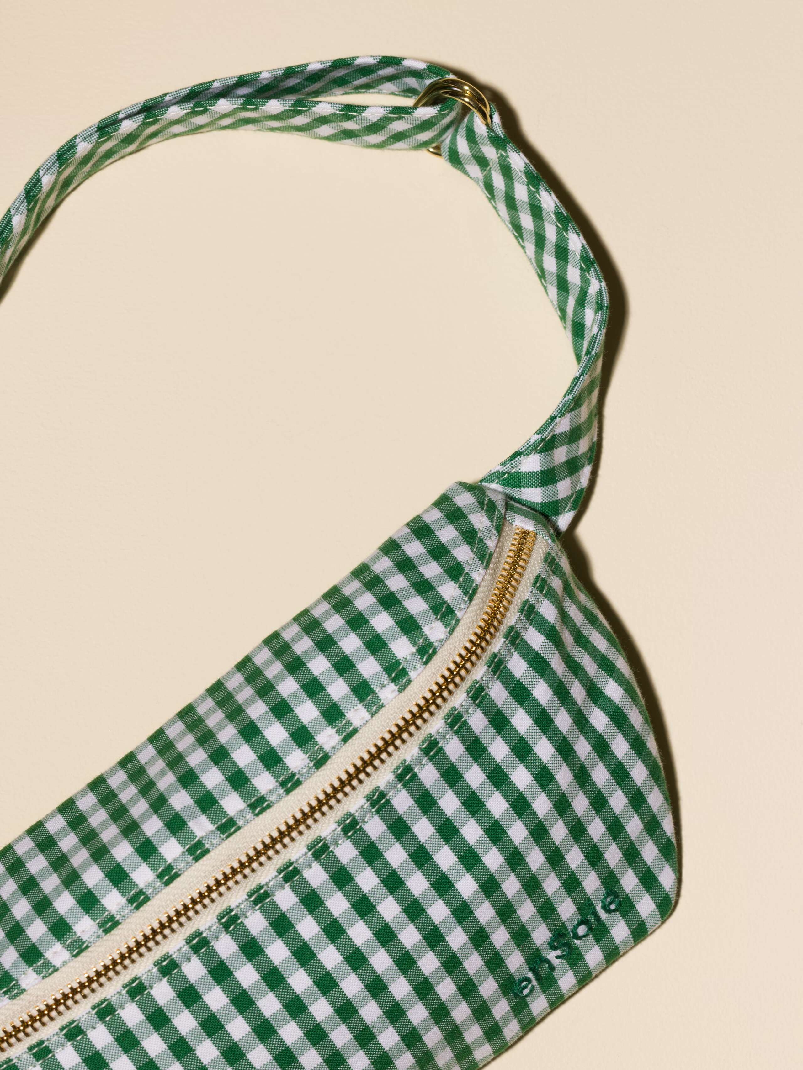 Picture of a cotton hip bag featuring a vichy check pattern 