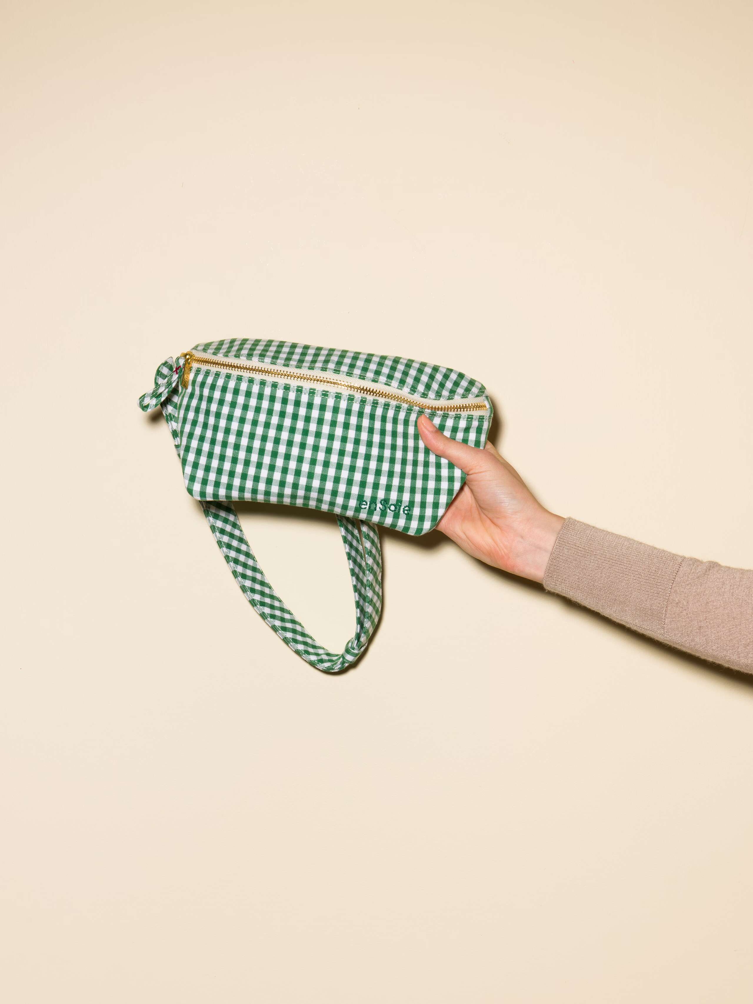 Picture of a hip bag featuring a green vichy check pattern