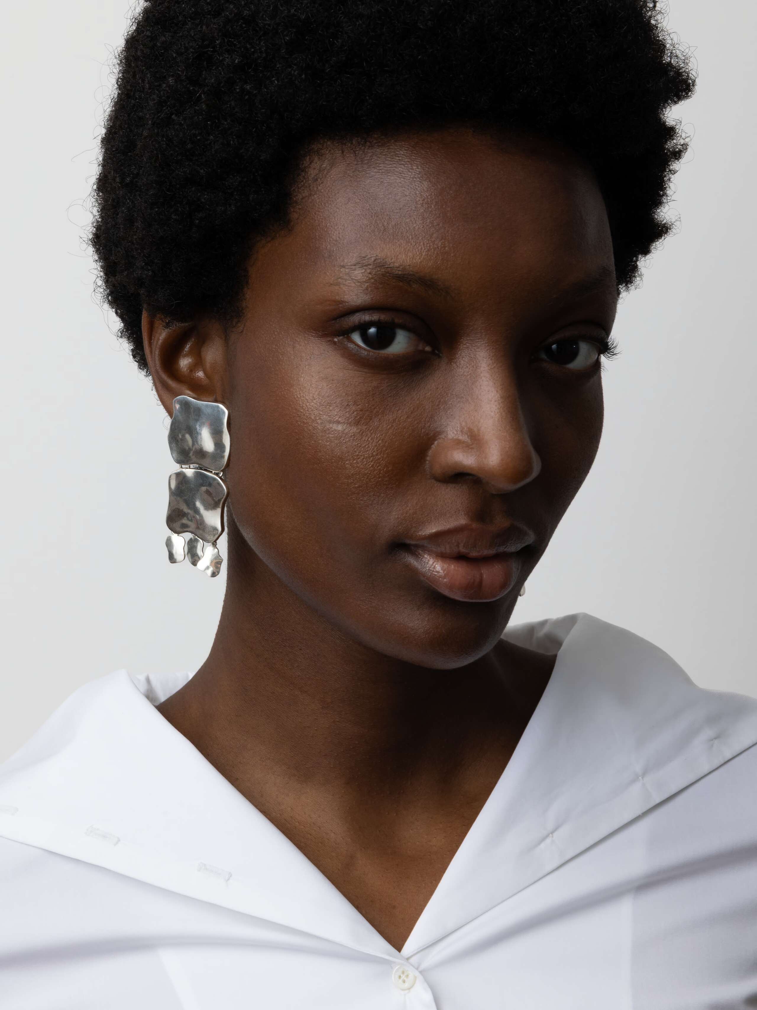 Product Shot of Amorph Earrings Silver on Model