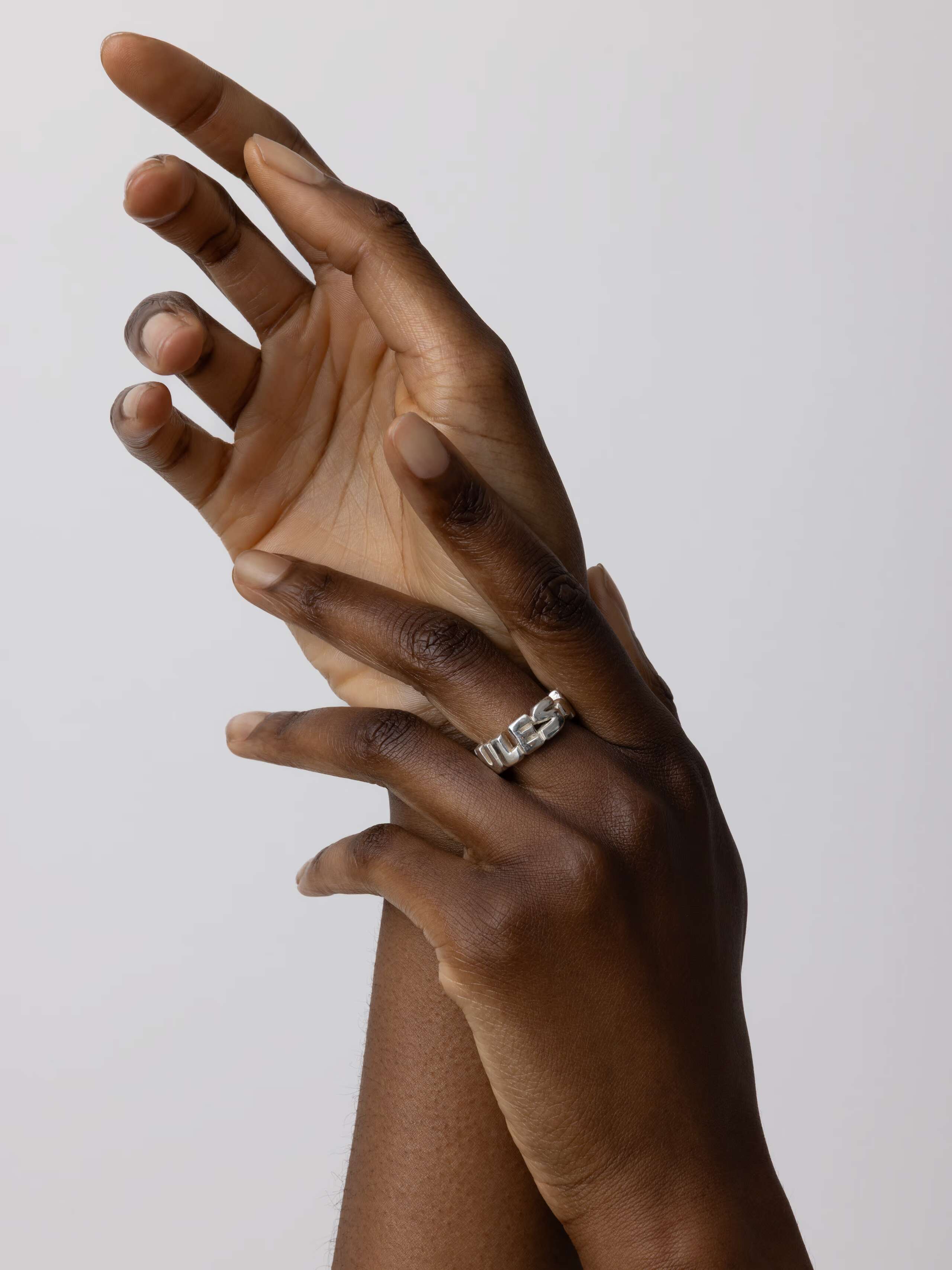 Product Shot of Love Rules Ring in Silver on Model
