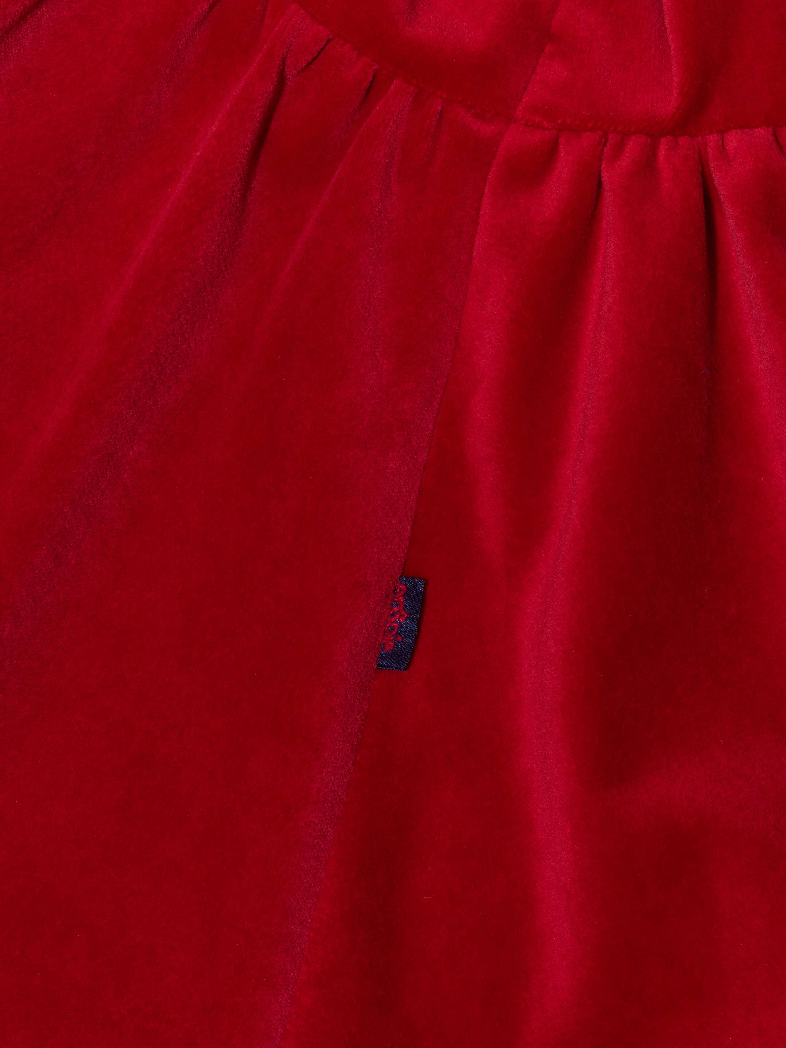 Detail of beautiful cotton velvet baby dress sleeveless with navy silk bow handmade in Zurich, red cotton velvet
