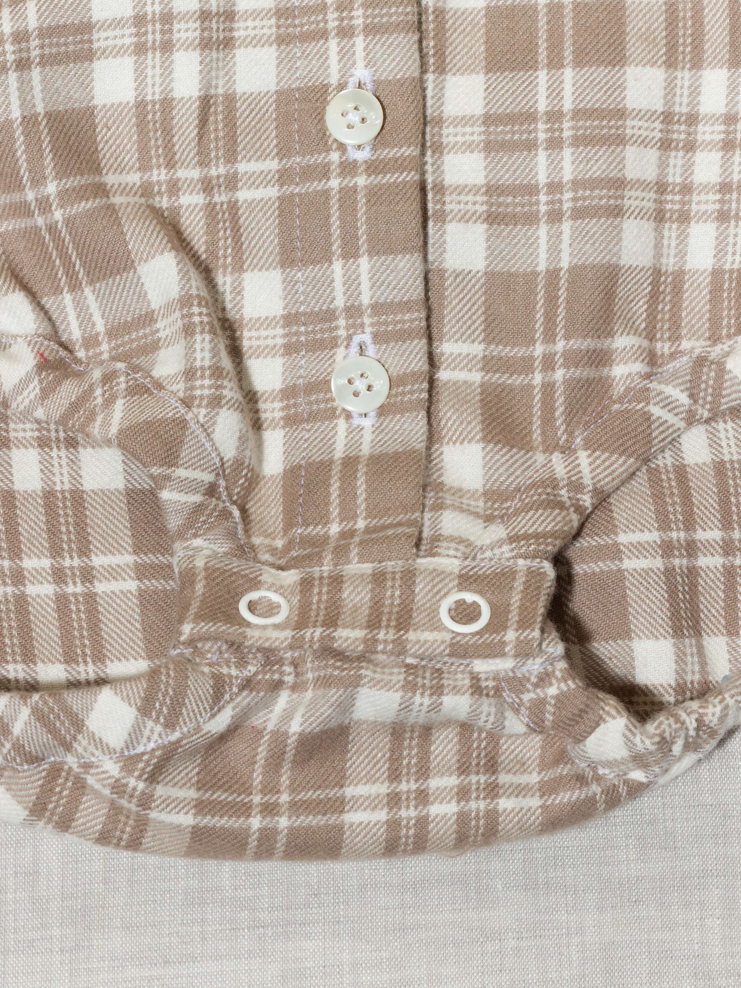 Beautiful handmade cotton flannel baby body in a soft check pattern with long sleeves, moon rock beige