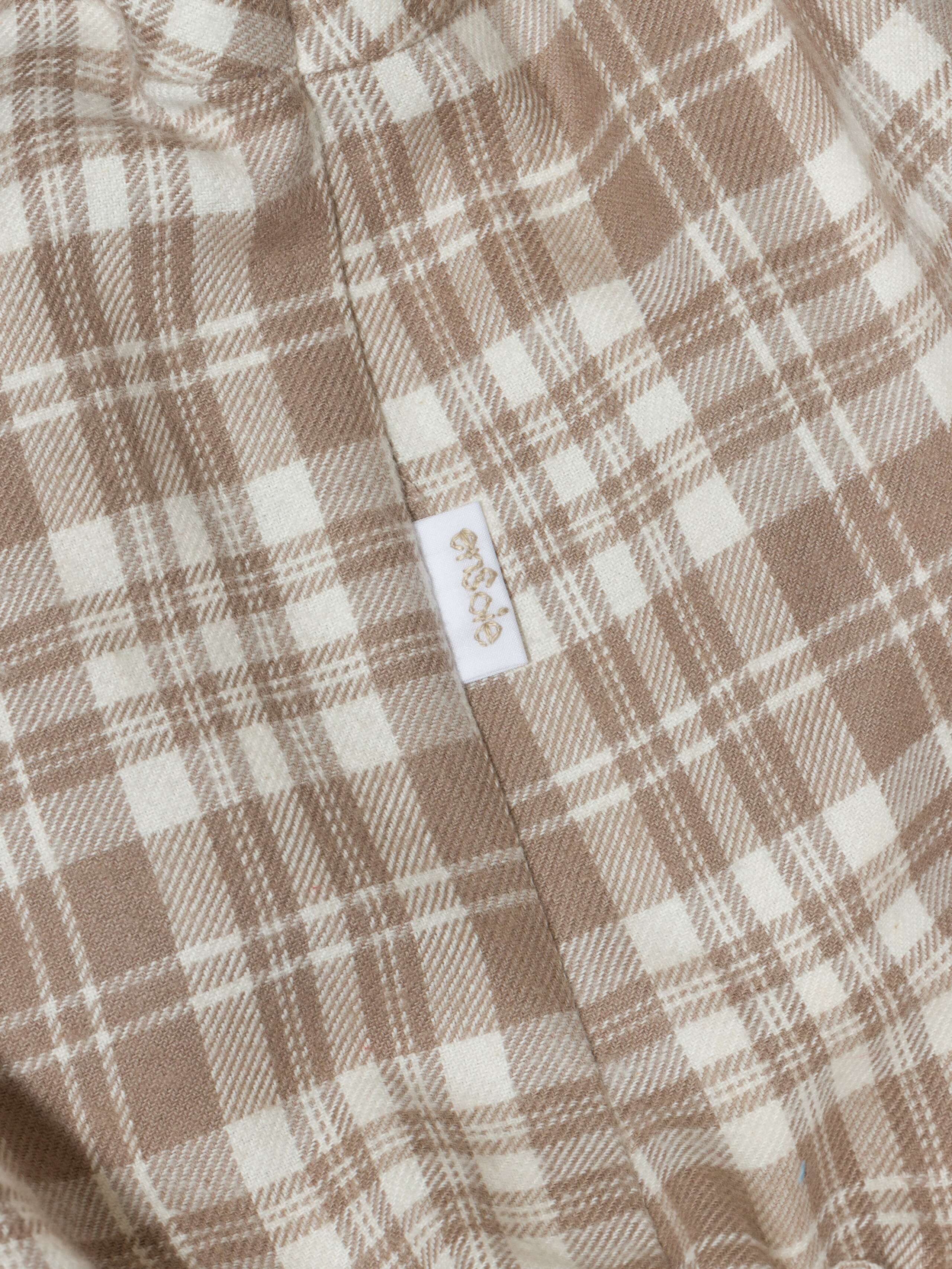 Beautiful handmade cotton flannel baby body in a soft check pattern with long sleeves, moon rock beige