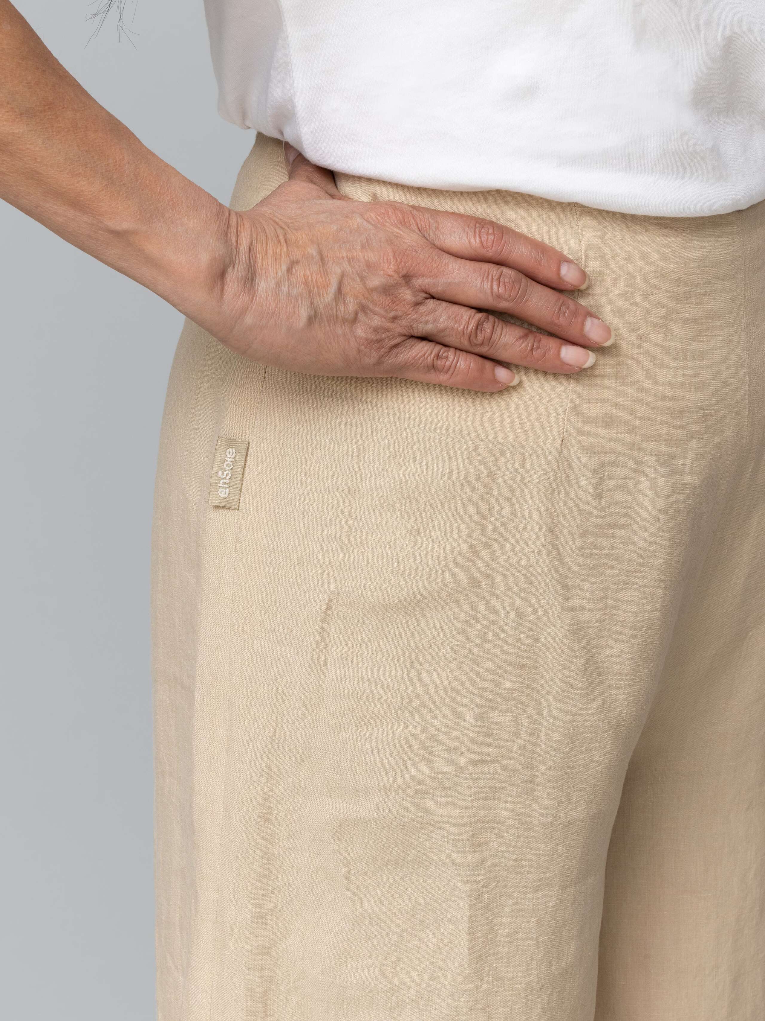 Detail of beautiful beige linen trousers