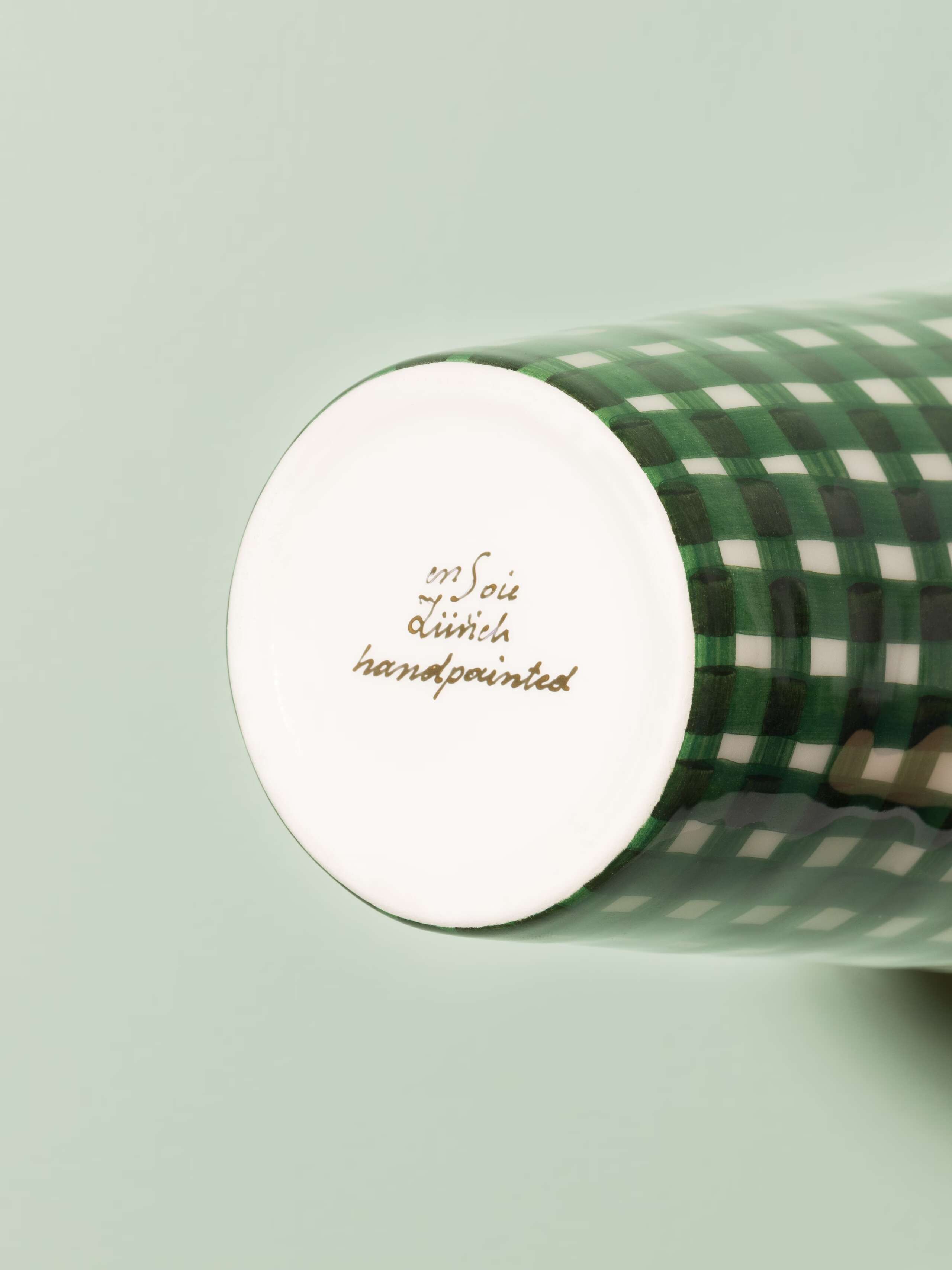 Picture of a small vase featuring a beautiful vichy check pattern in dark green