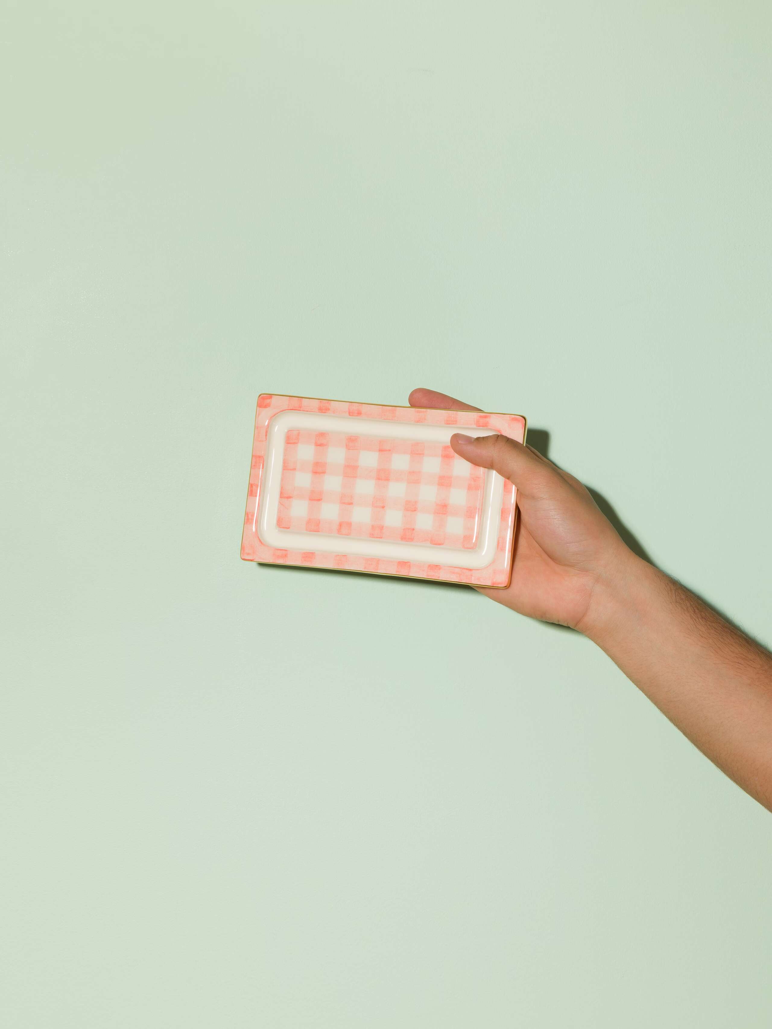 Picture of a beautiful handmade ceramic butter plate featuring a pink vichy check pattern