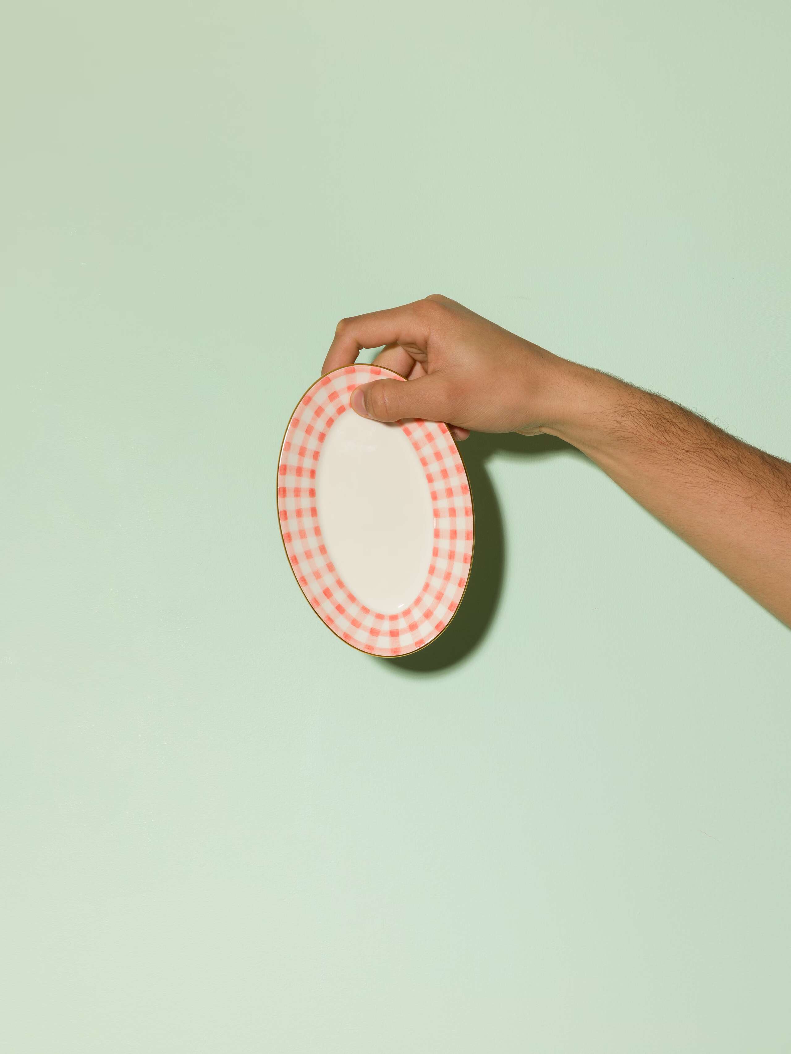 Picture of a beautiful small tapas plate featuring a pink vichy check pattern rim 