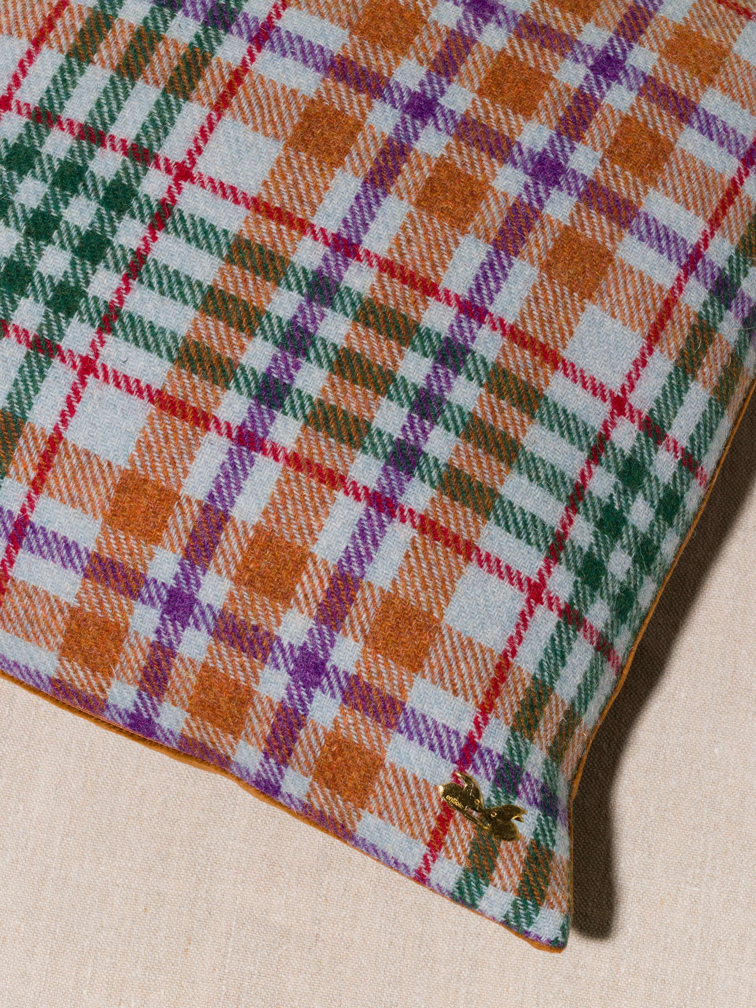 Picture of a detail of a beautiful pillow cover made of harris tweed in beautiful autumn colour shades
