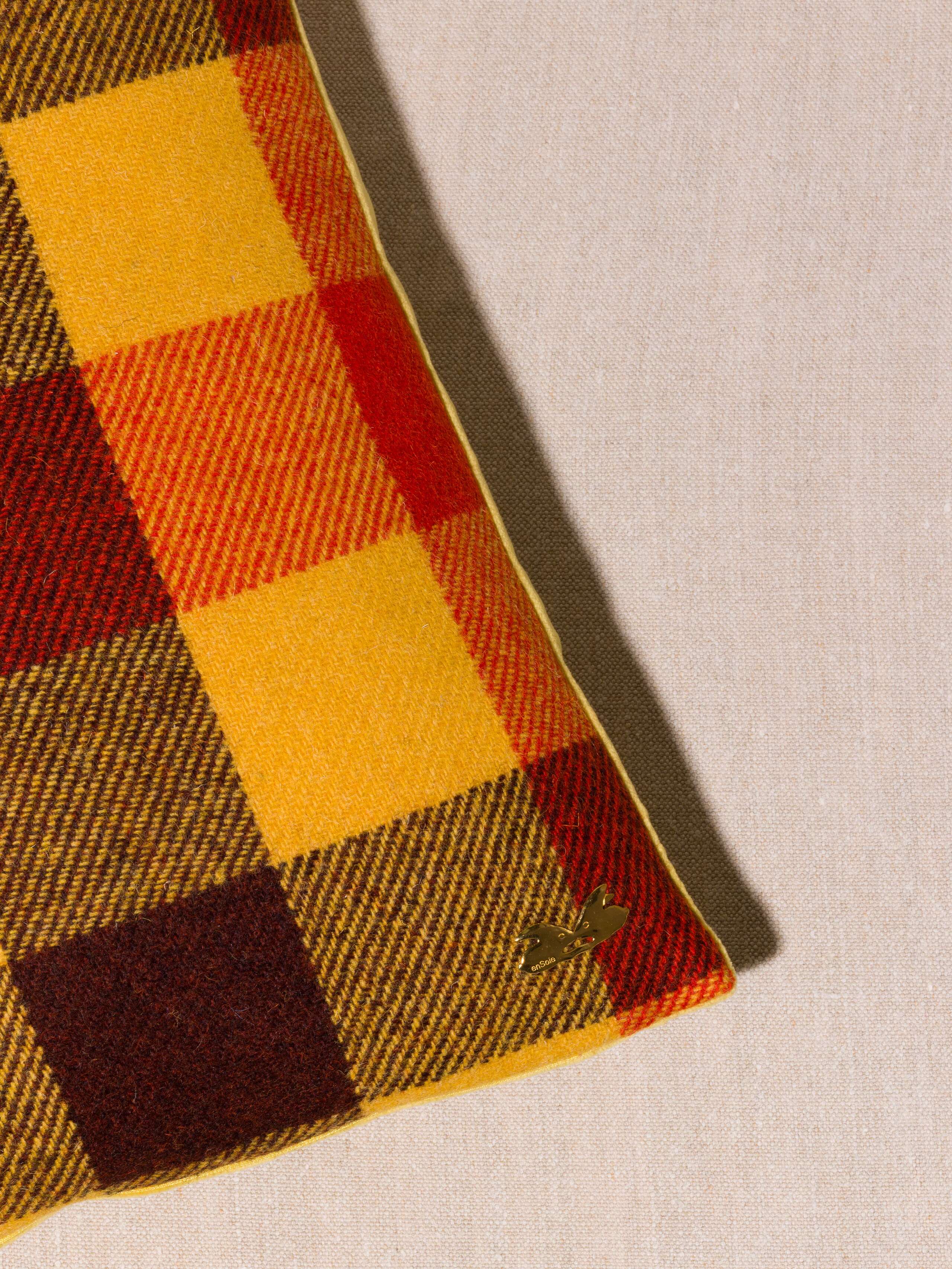 Picture of a detail of a beautiful pillow cover made of harris tweed in beautiful autumn colour shades