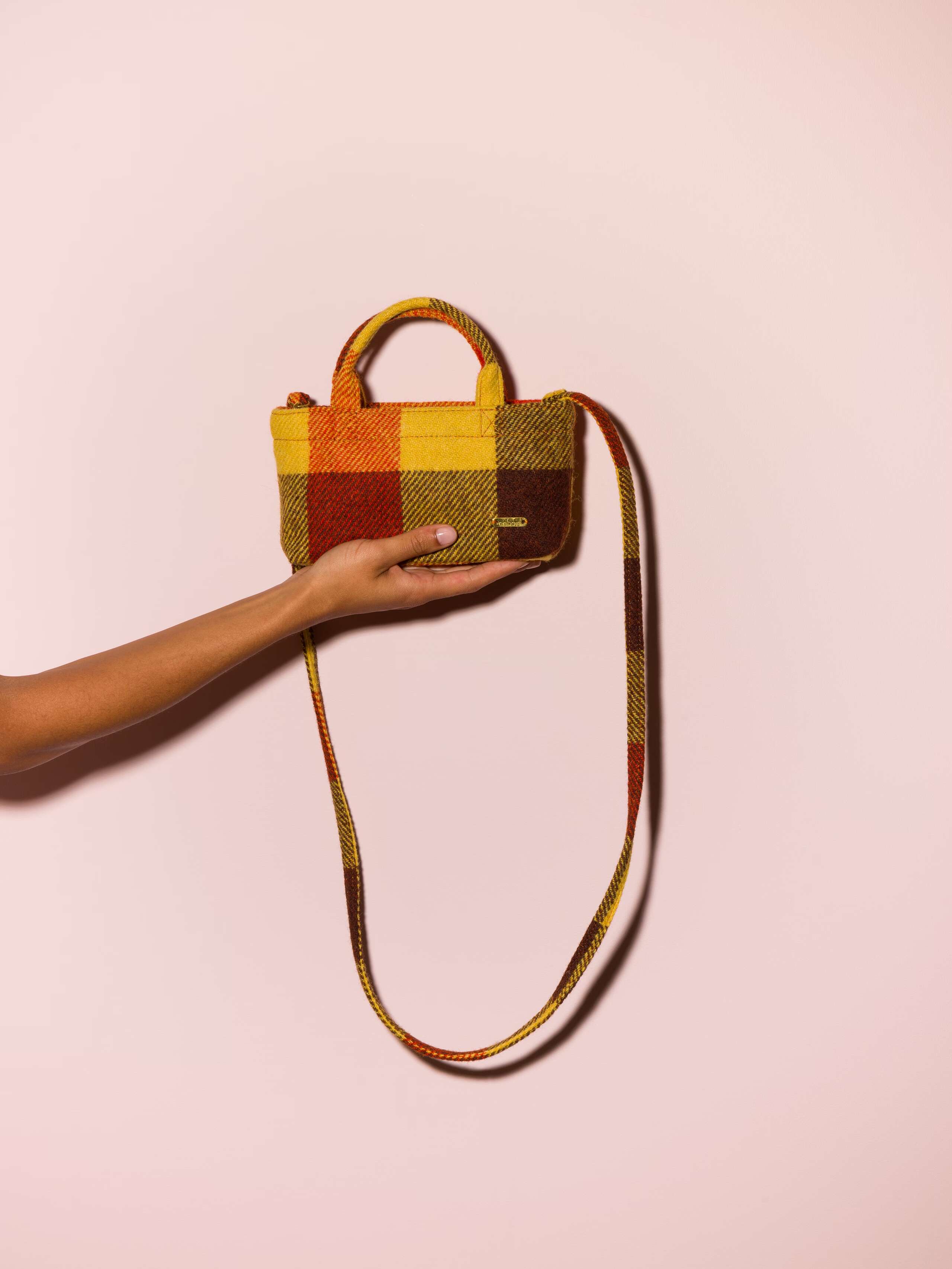 Picture of a micro hand bag made of colourful Harris Tweed fabric