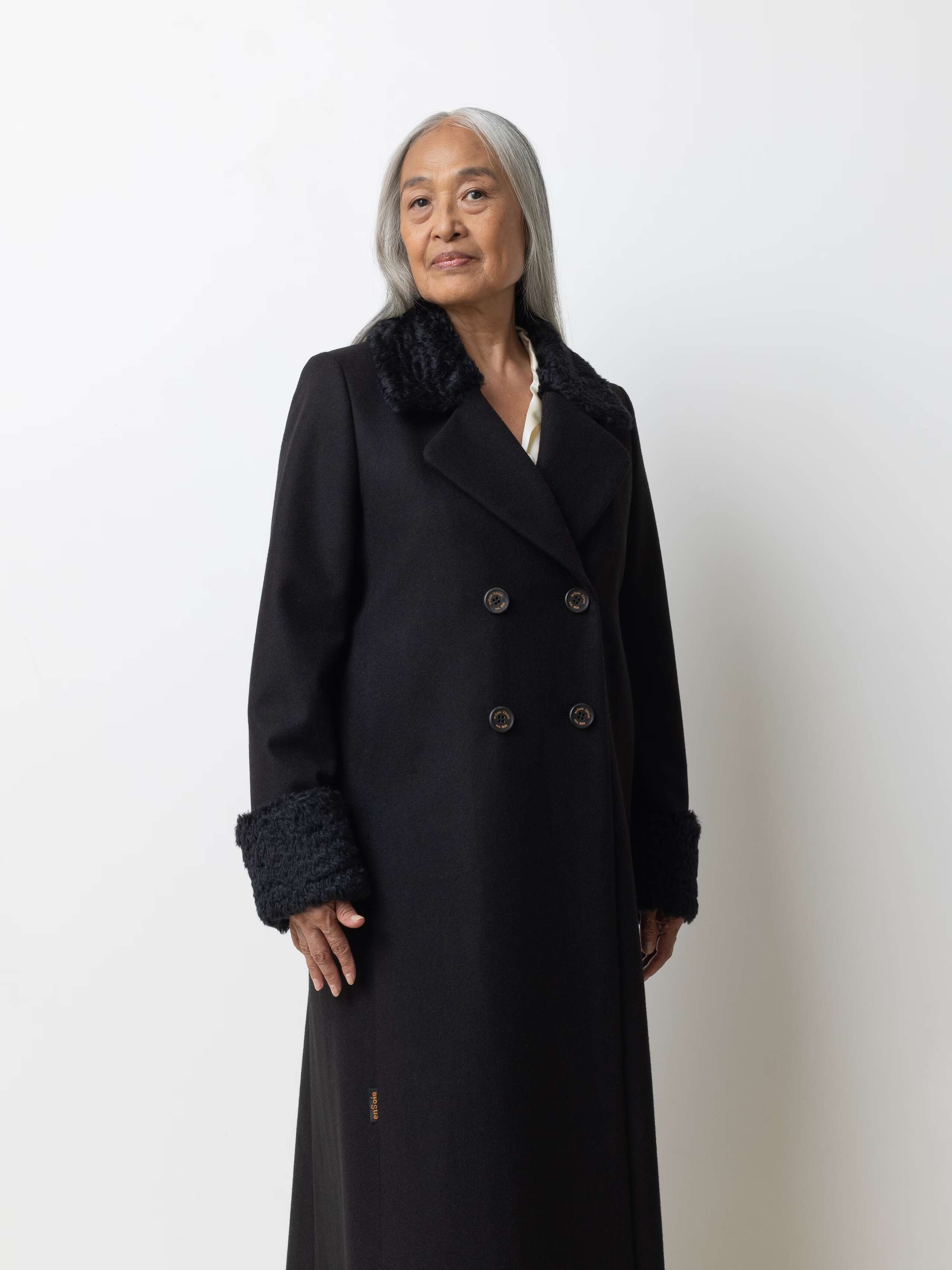 Picture of a female model wearing a black winter coat