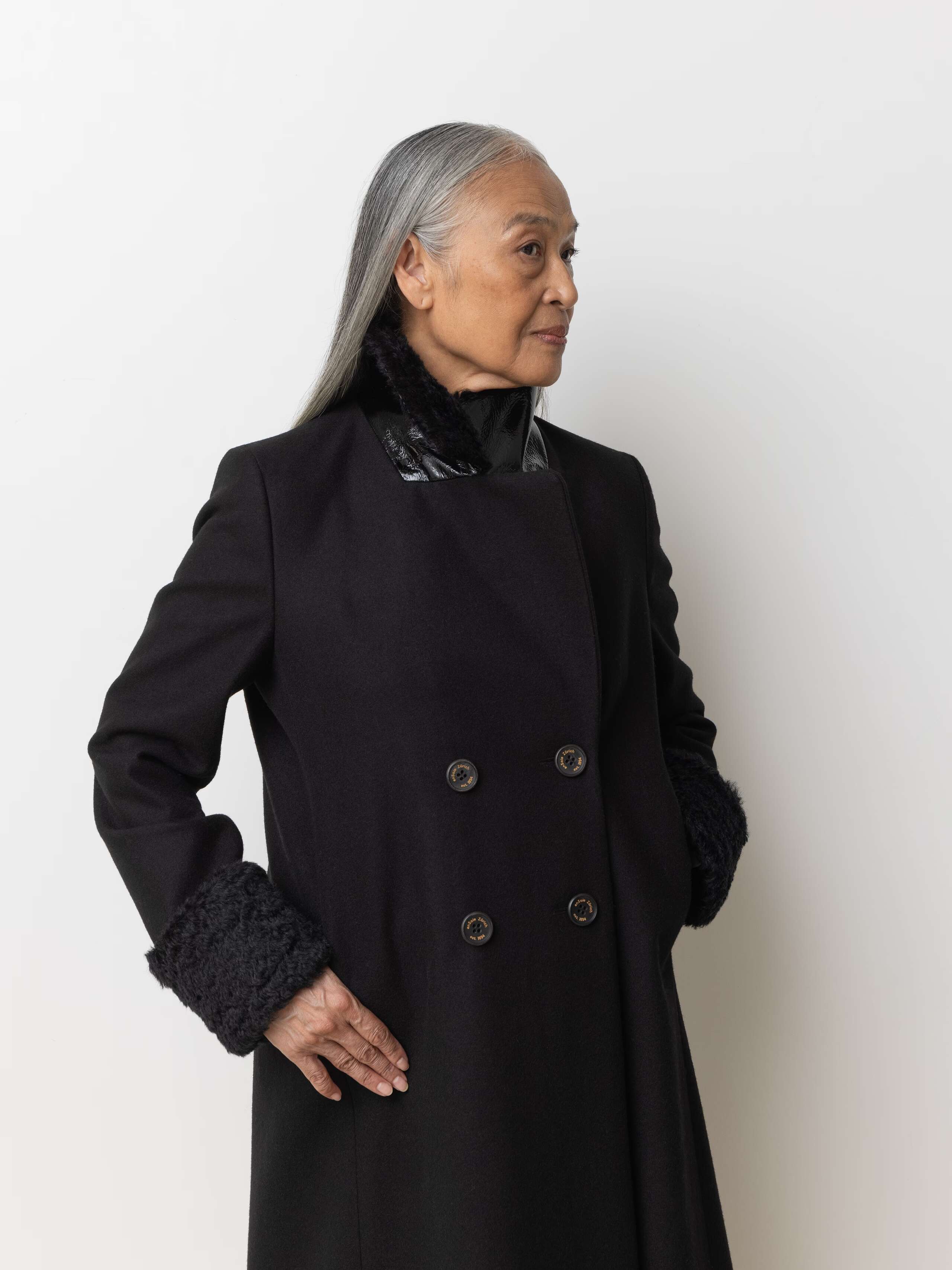 Picture of a female model wearing a black winter coat