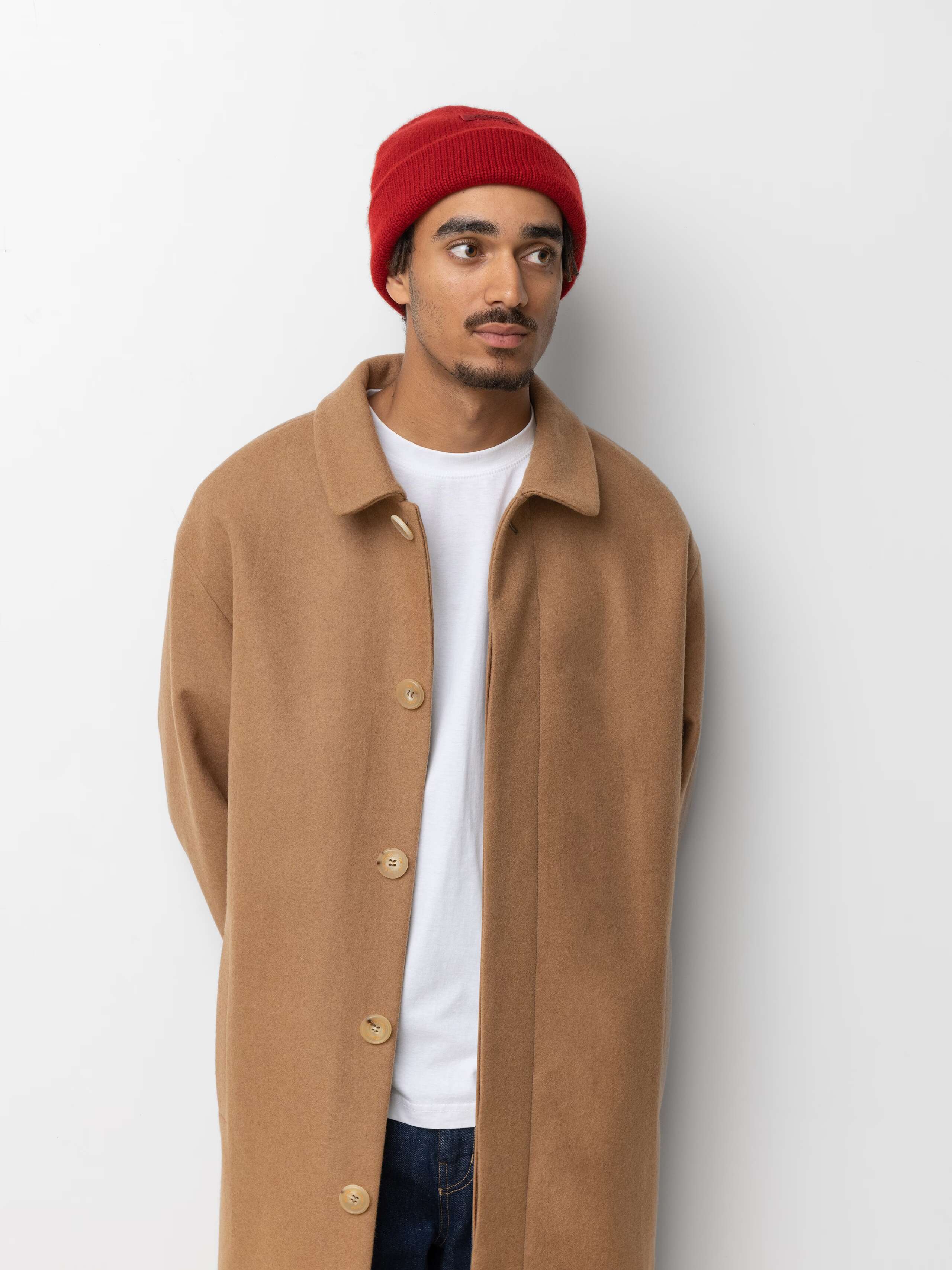 Picture of a male model wearing a red cashmere beanie