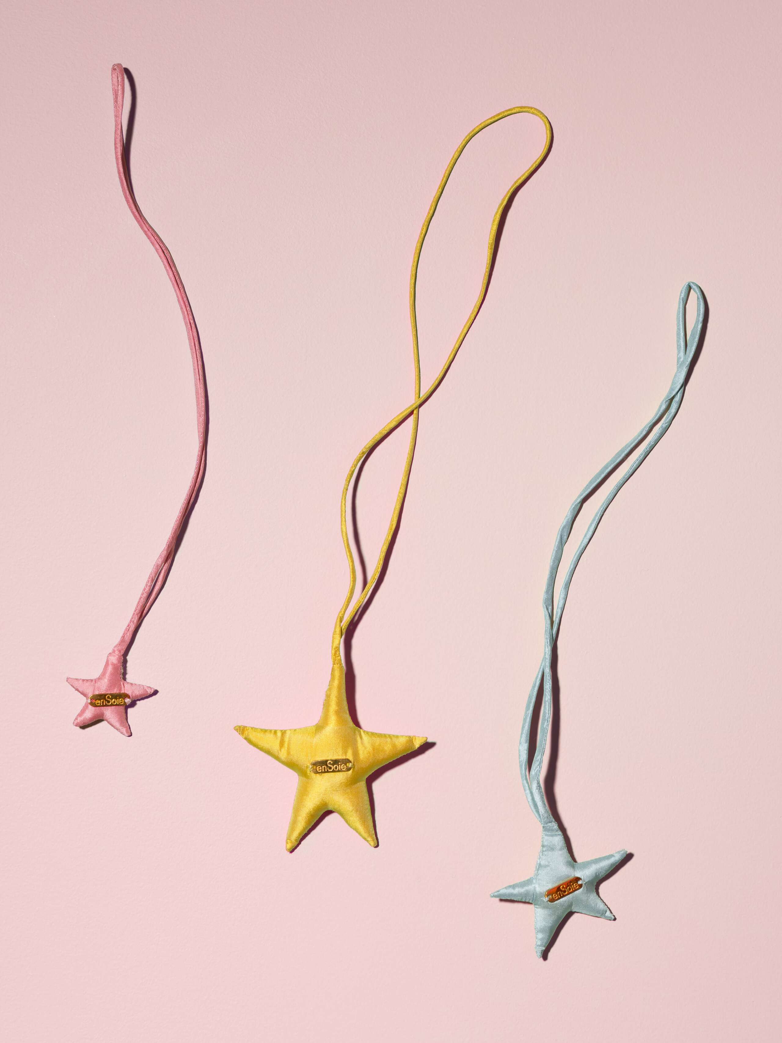 Picture of three colourful silk star ornaments