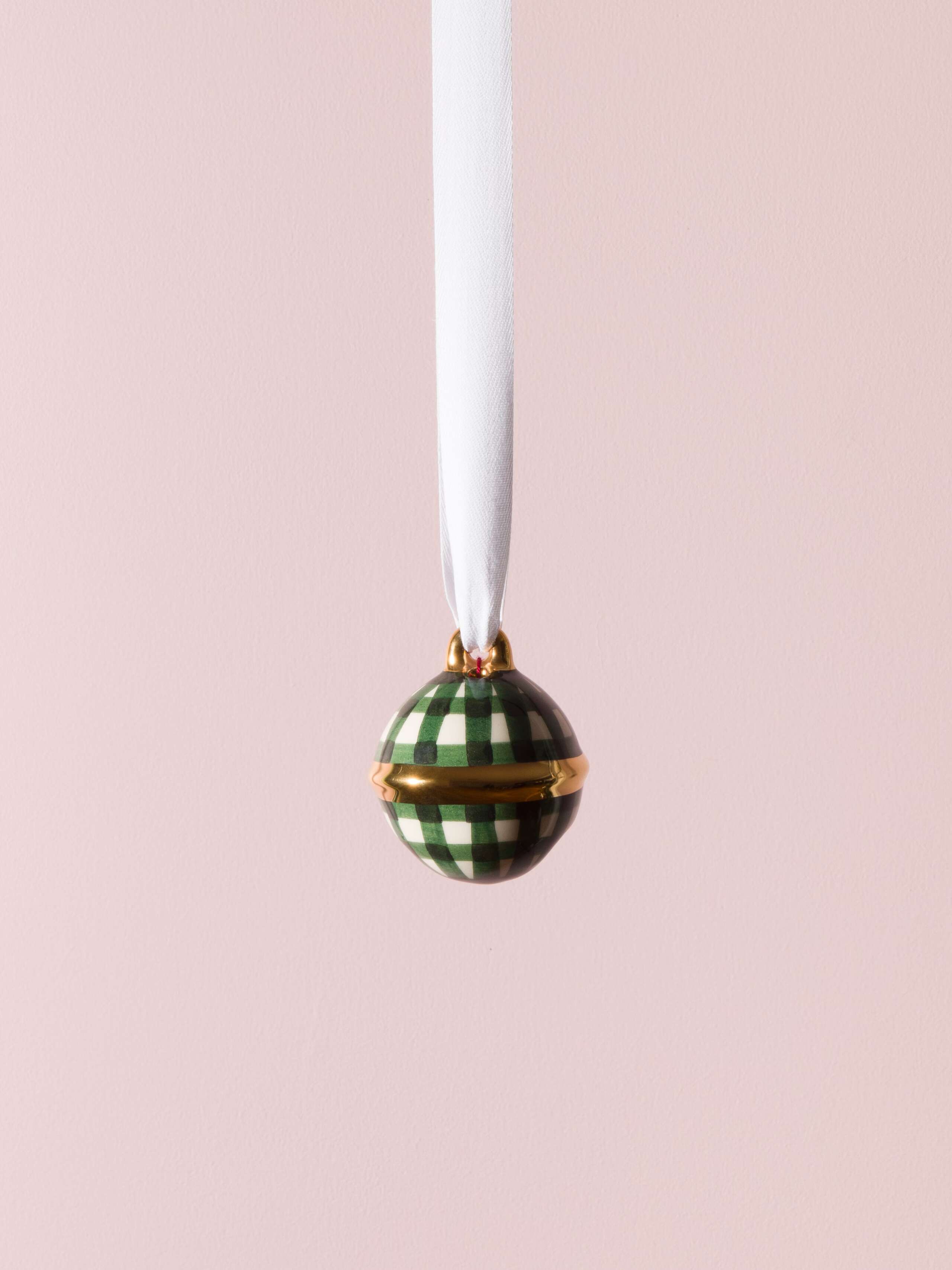 Picture of a swiss bell christmas tree ornament featuring a stunning dark green check pattern