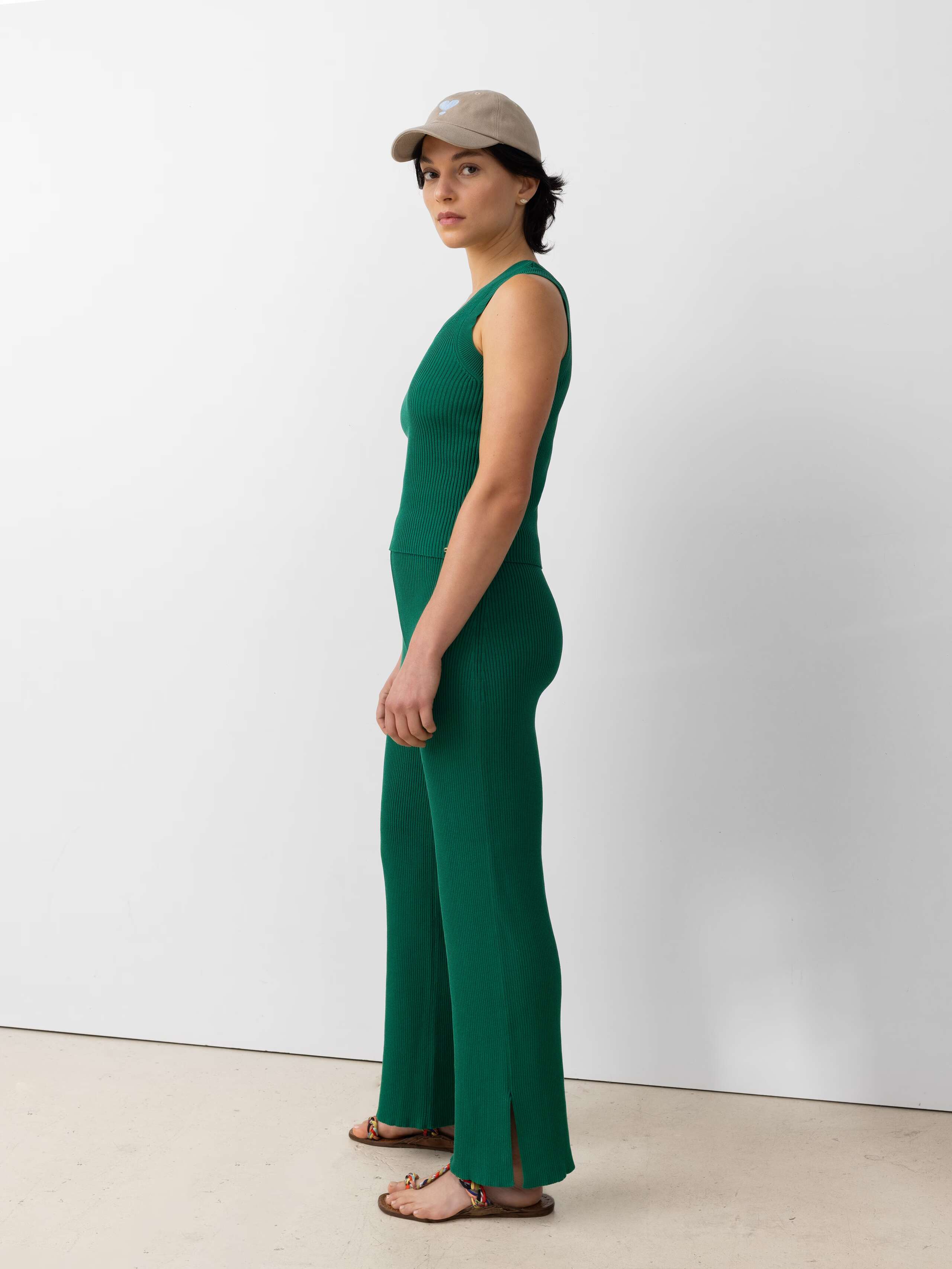 Model wearing the Emma trousers in a beautiful green knittred cotton