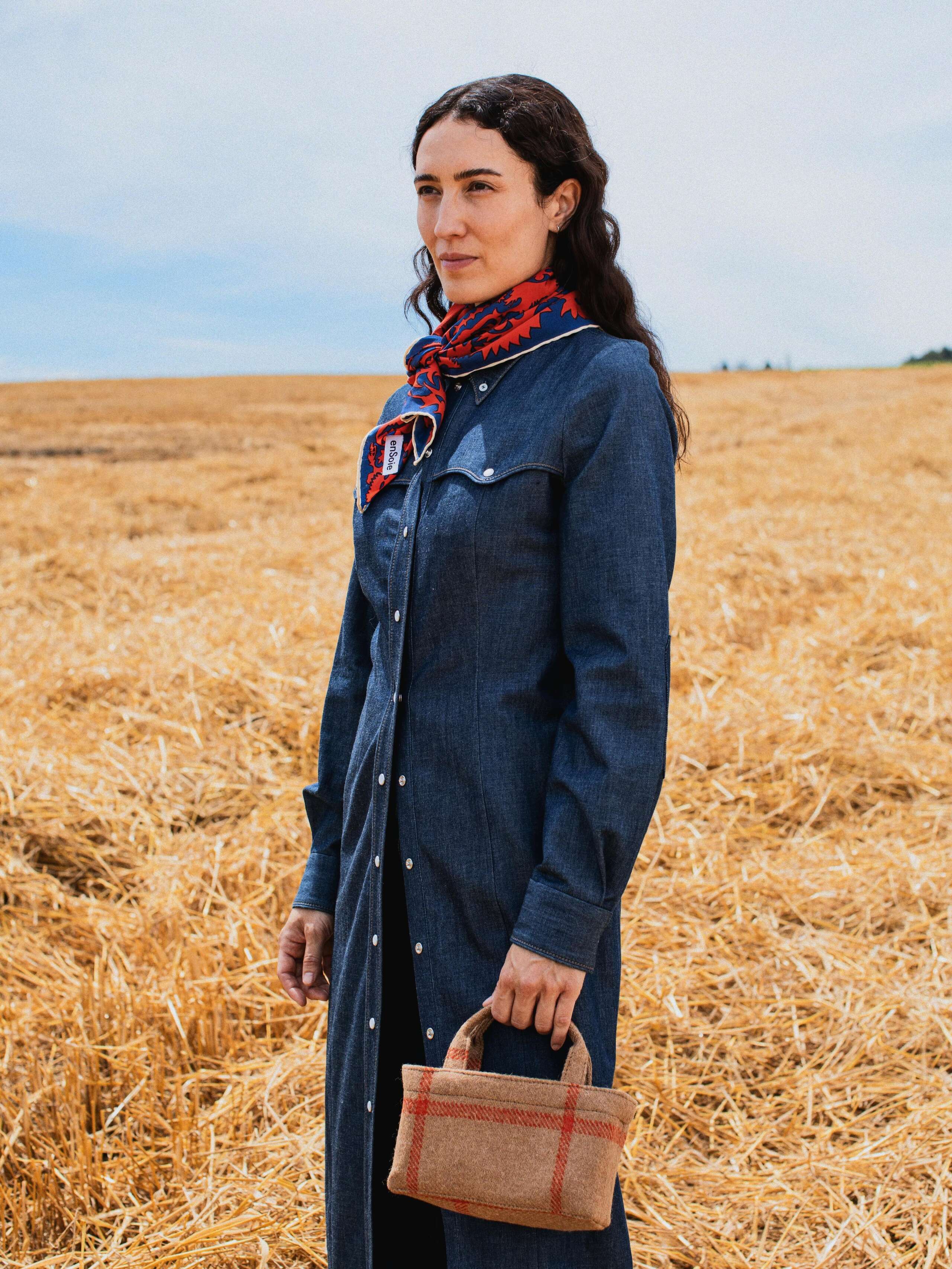 Picture of a female model wearing a denim dress