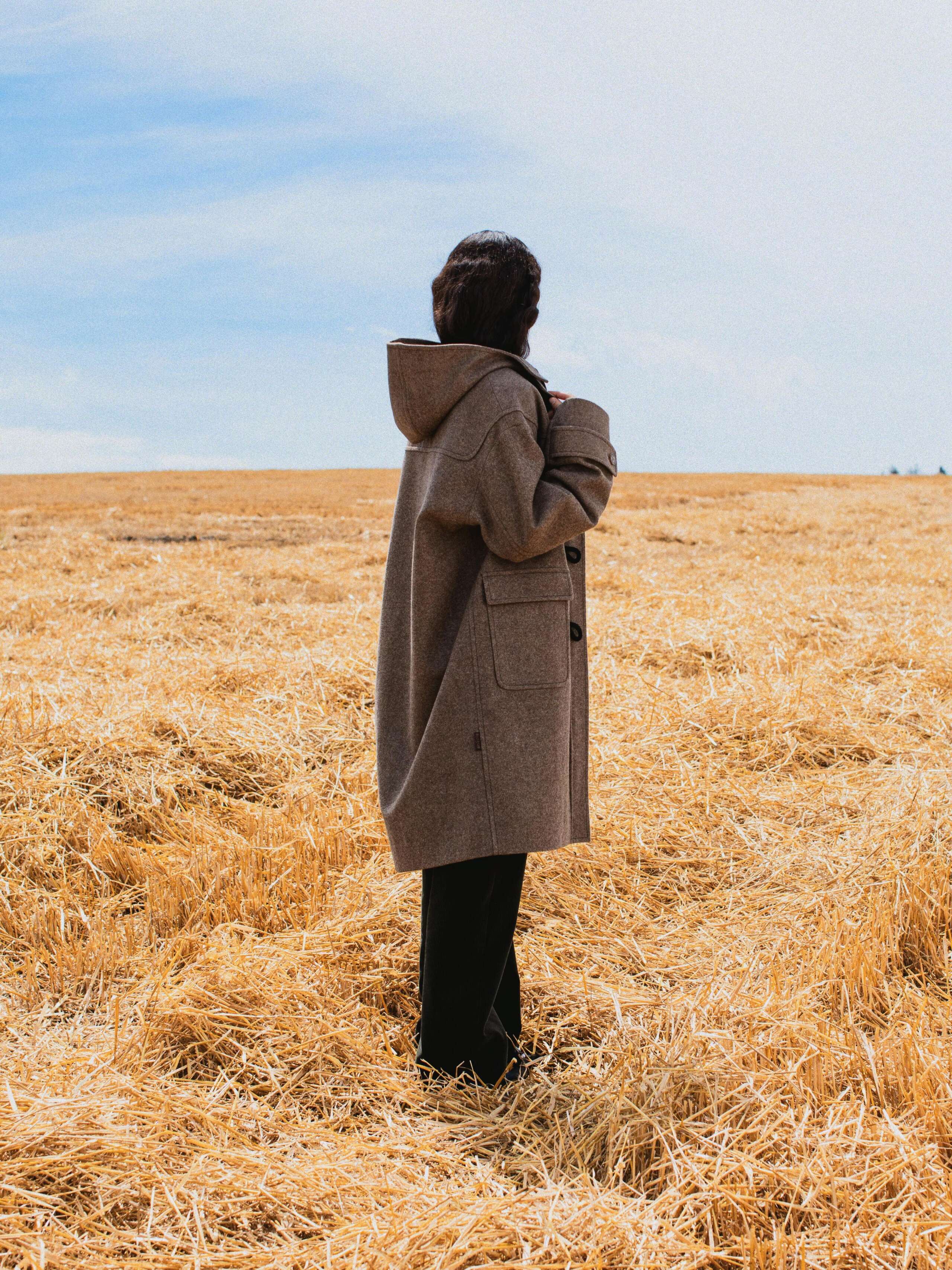Picture of a female model wearing a brown wool coat