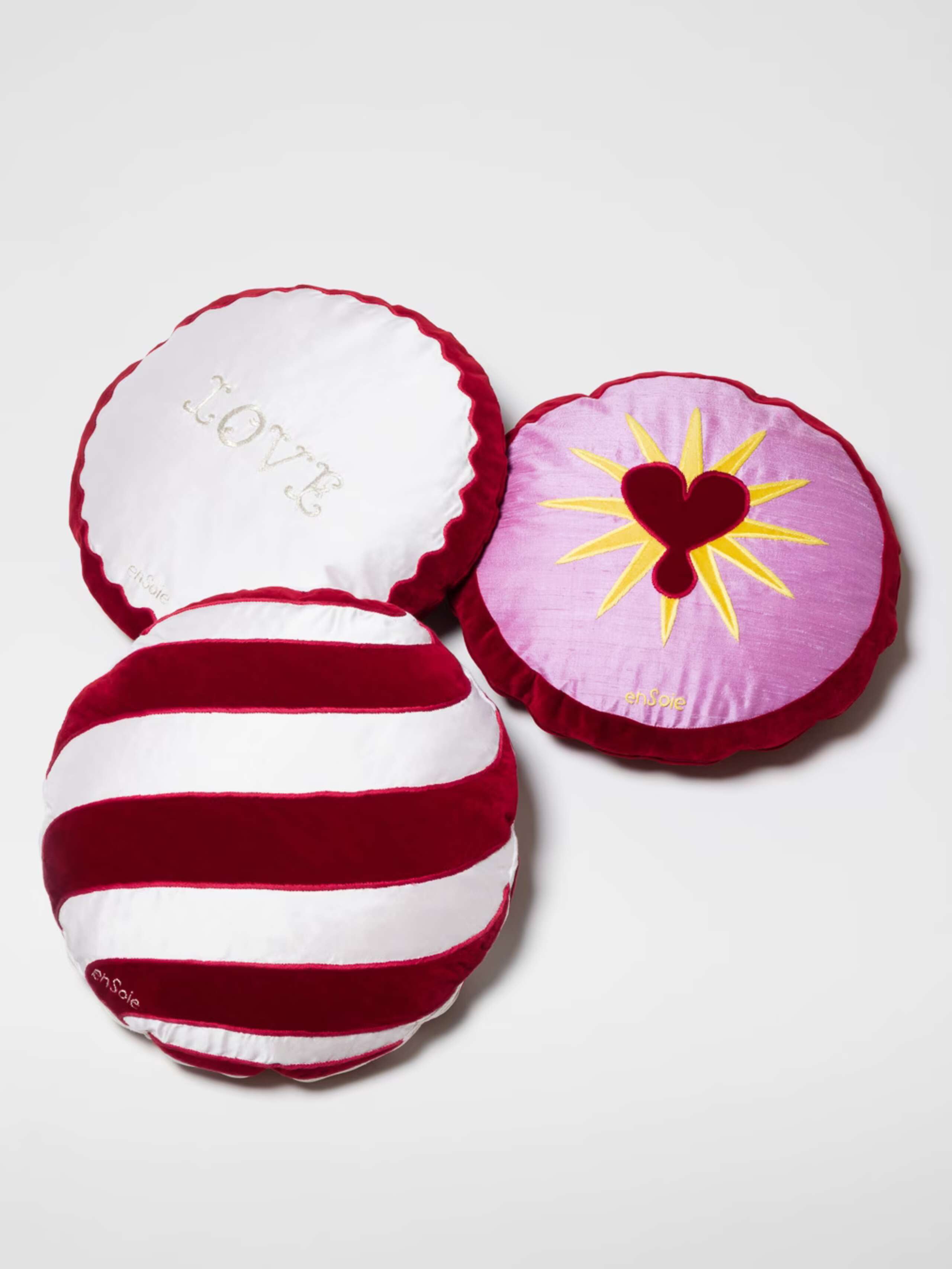 Picture of three round pillows made of velvet and silk