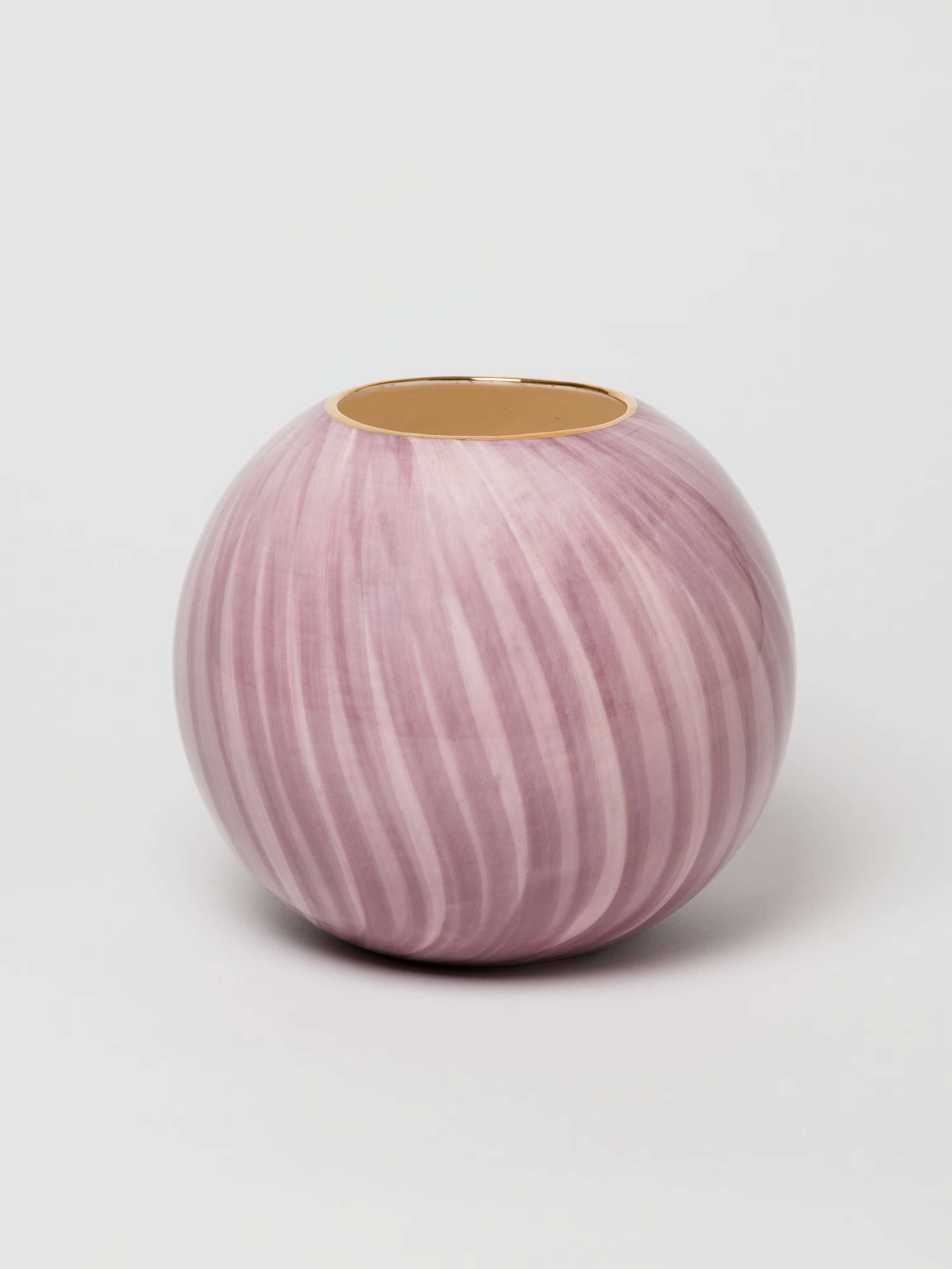 Picture of a beautiful round ceramic vase in a warm purple shade
