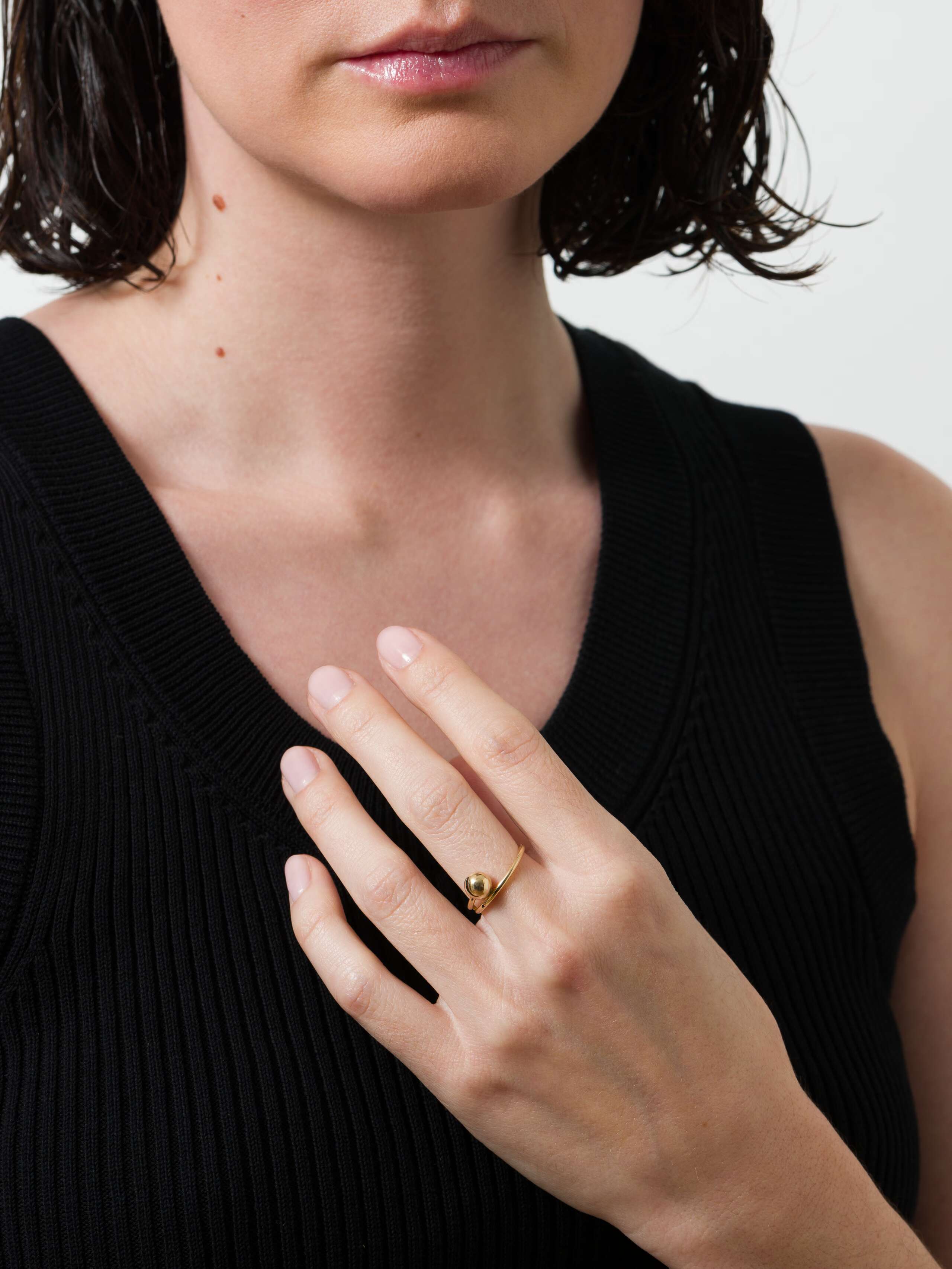 Model wearing the pushpin ring in 9 Karat gold
