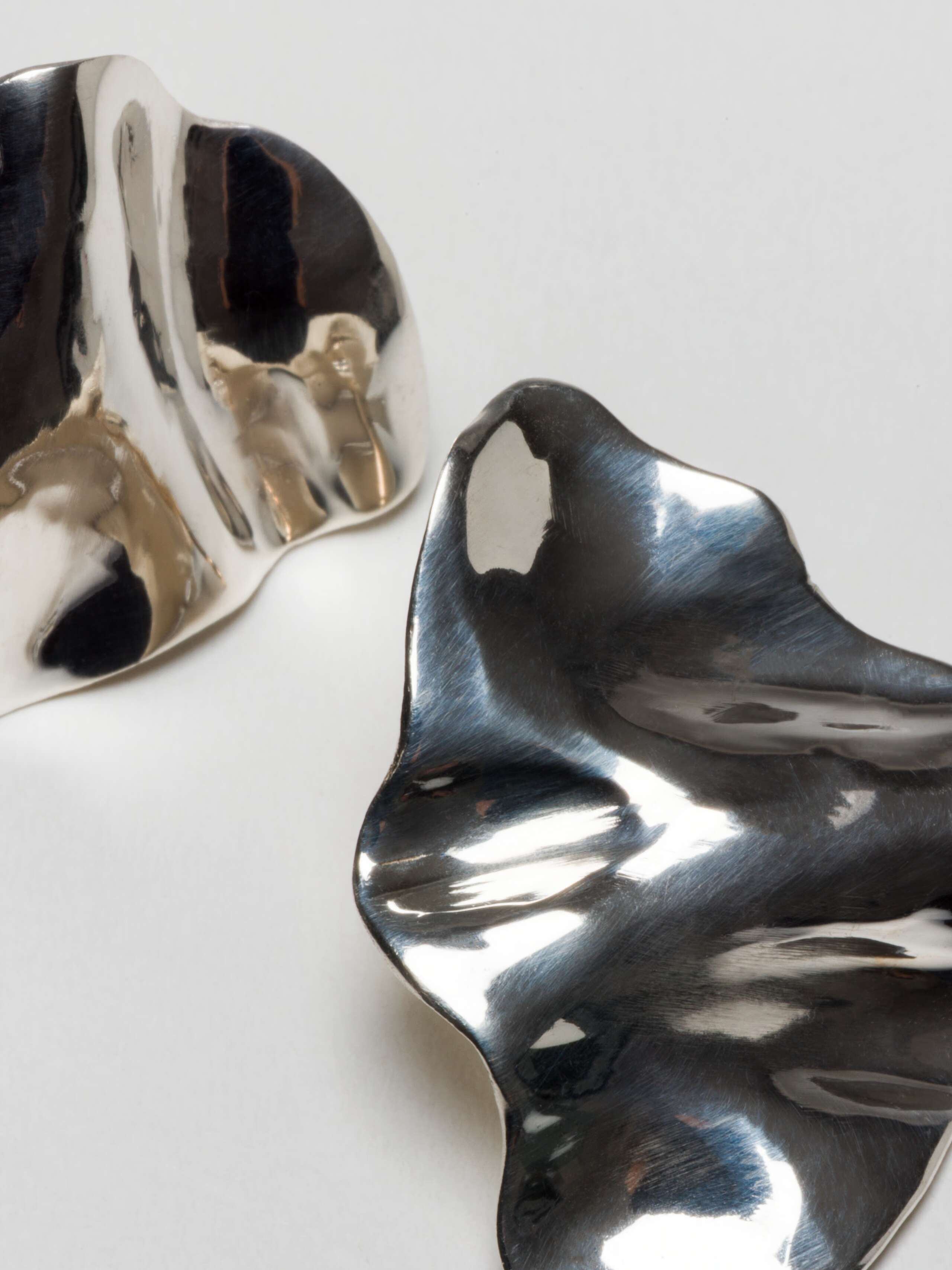 close up of Shape earstuds in silver