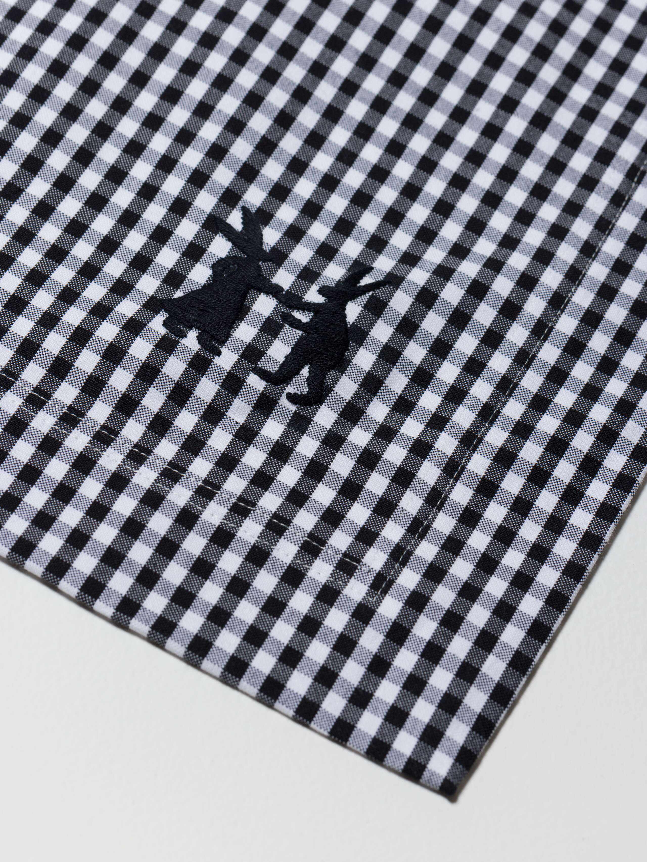 Charlotte Table cloth Detail showing S Size (without trim) with the embroidered dancing rabbits Logo