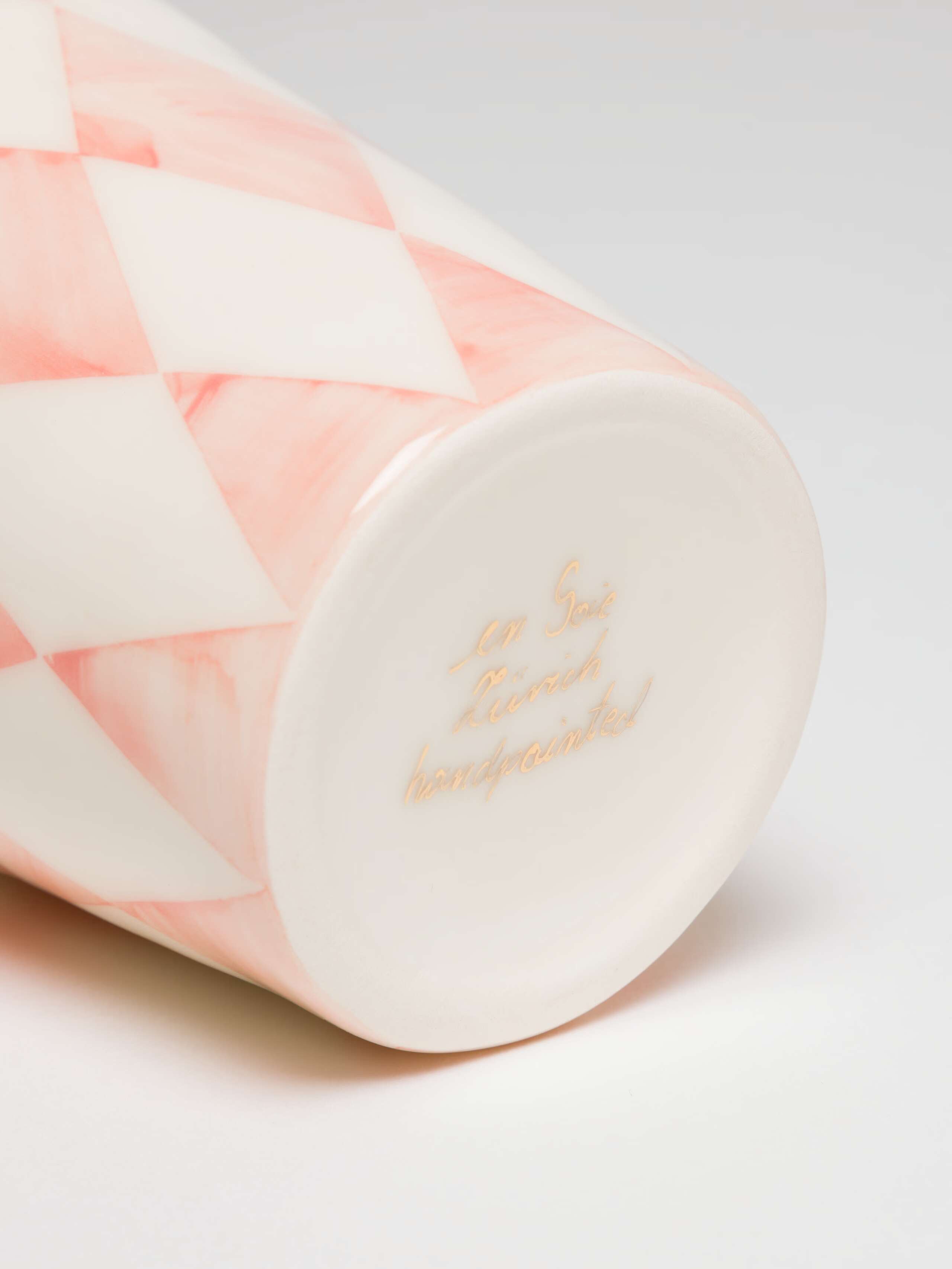 Handwritten Signature on bottom of cup