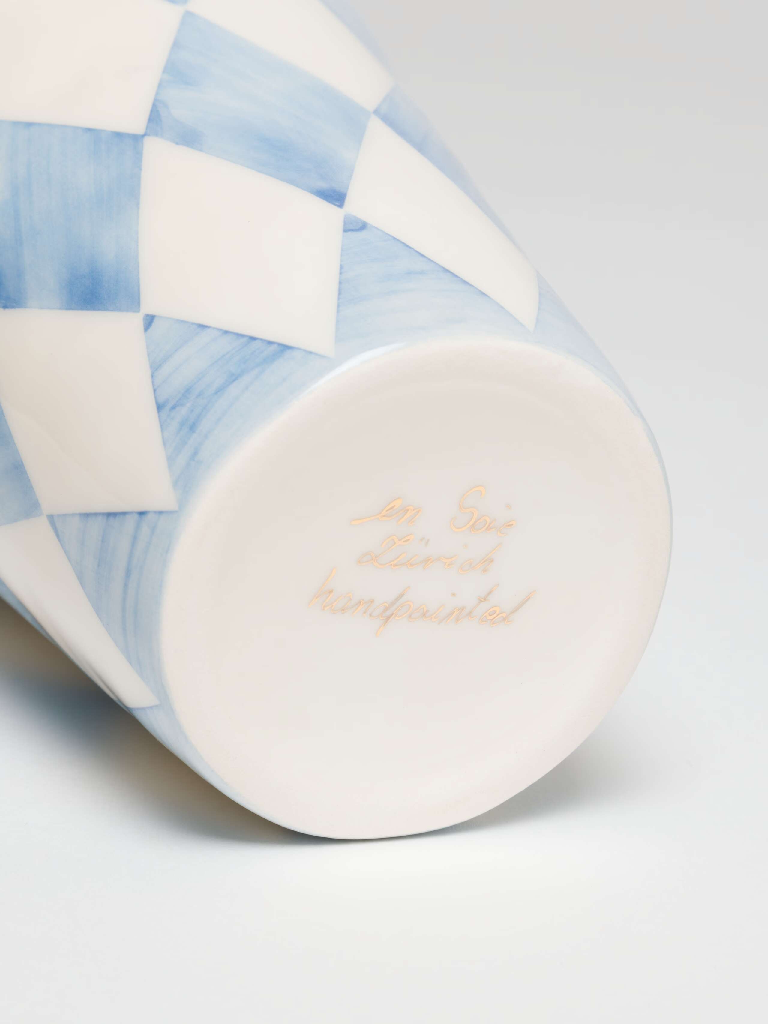 Handwritten Signature on bottom of cup