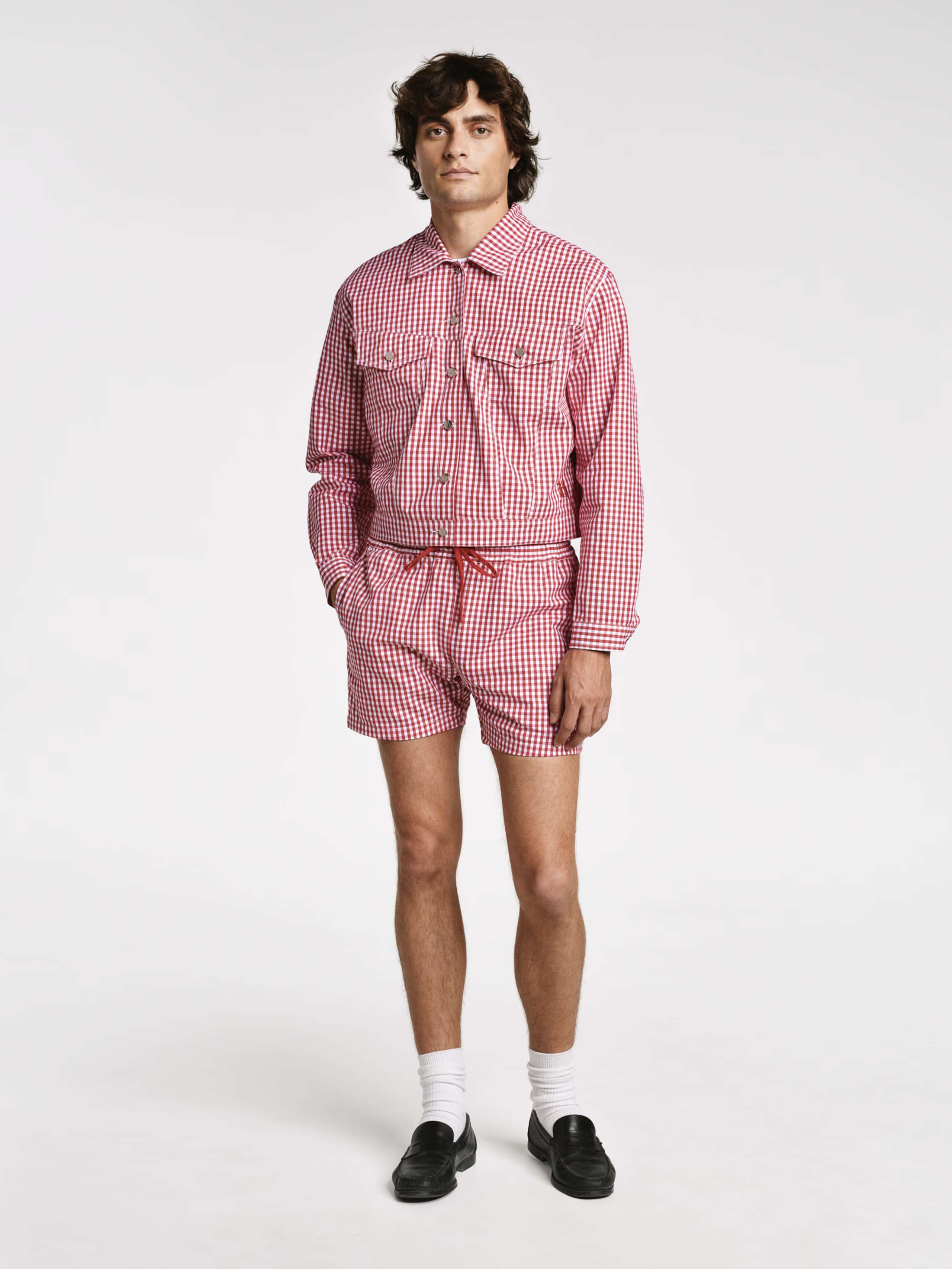 Model wearing the red vichy check Jill jacket