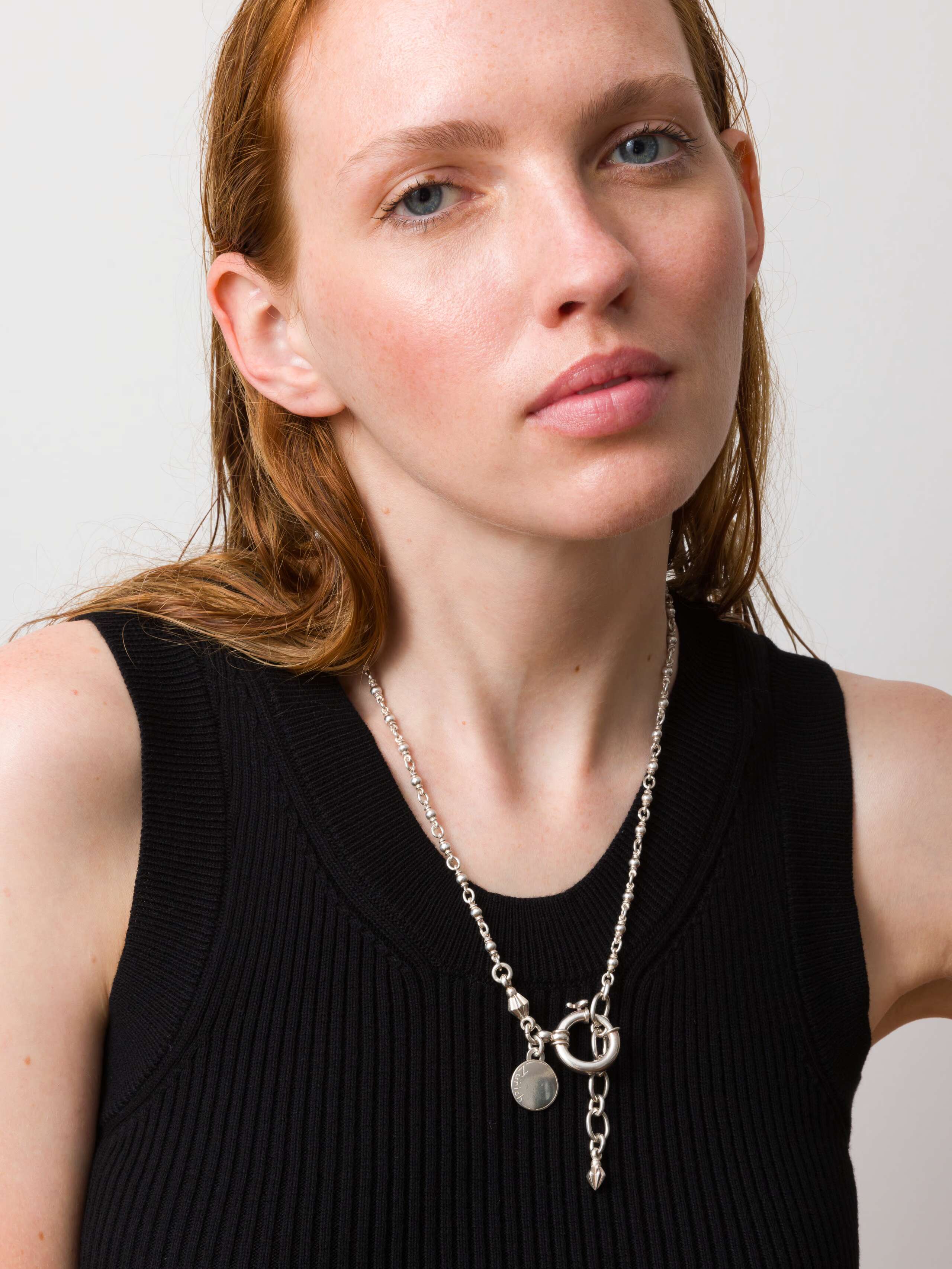 Model wearing small ball necklace in 55cm