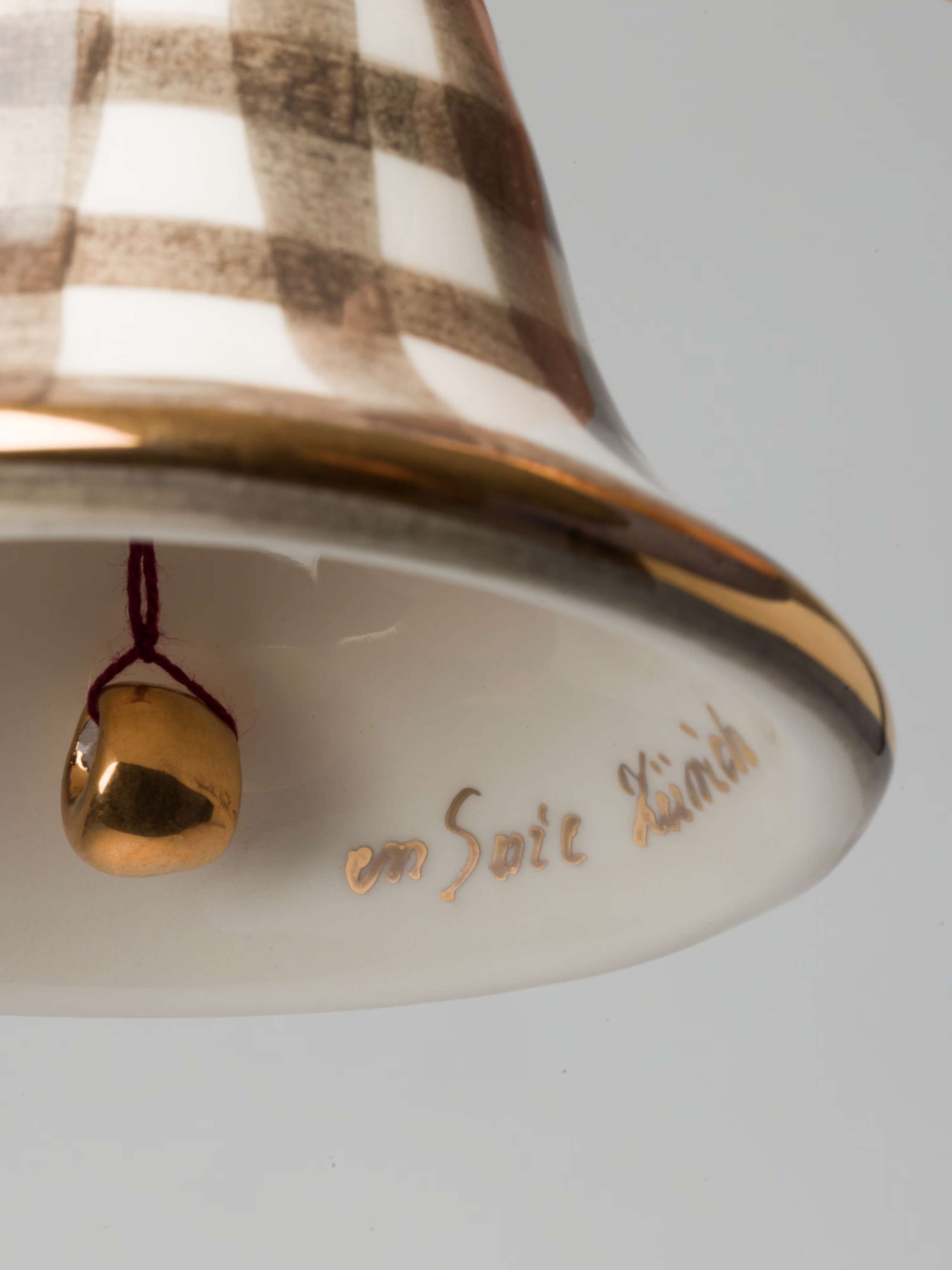 Bell ceramic ornament detail in moon rock