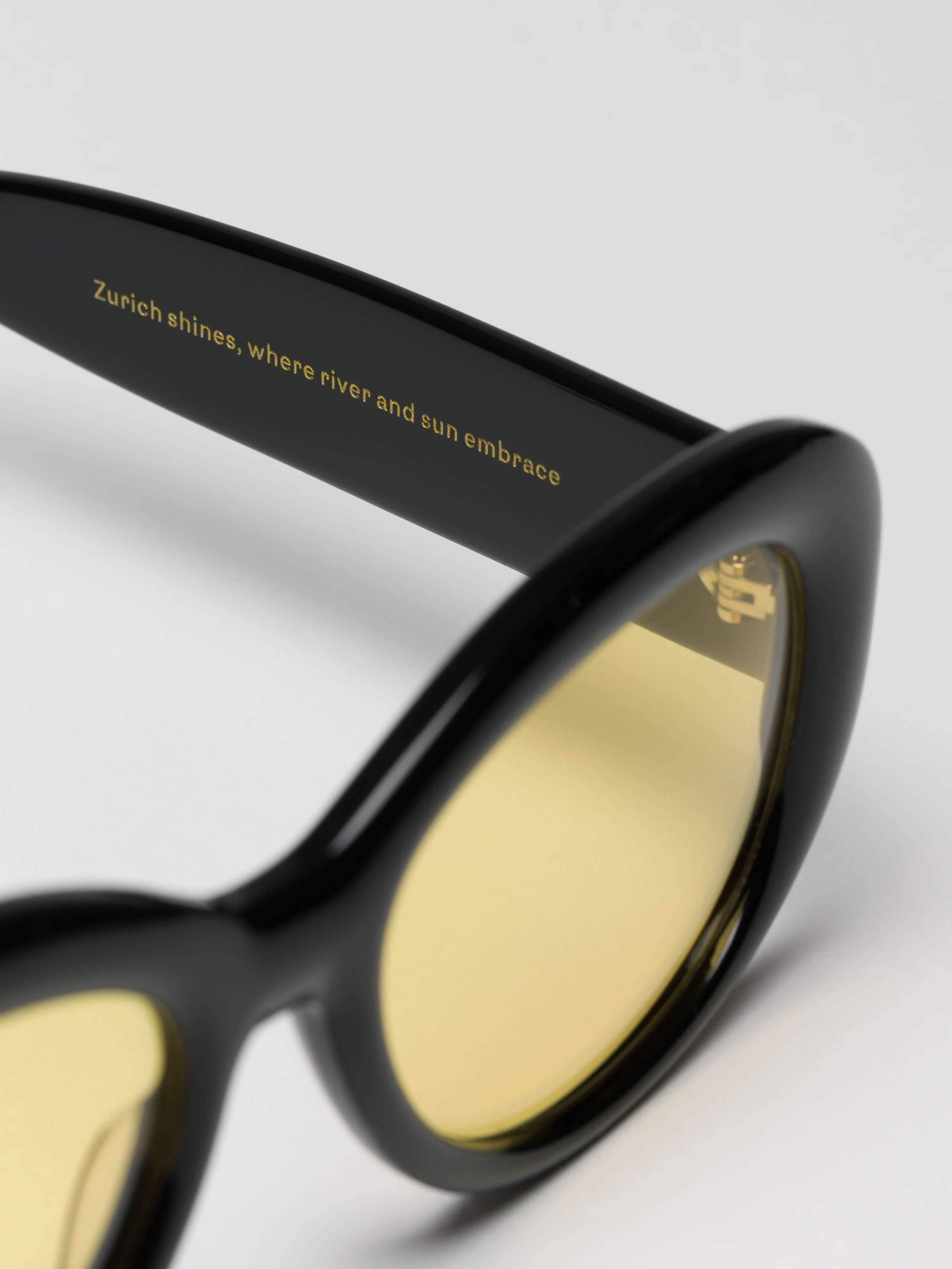 Angled Detail Shot of lenses of Capri Sunglasses in Black-Yellow 