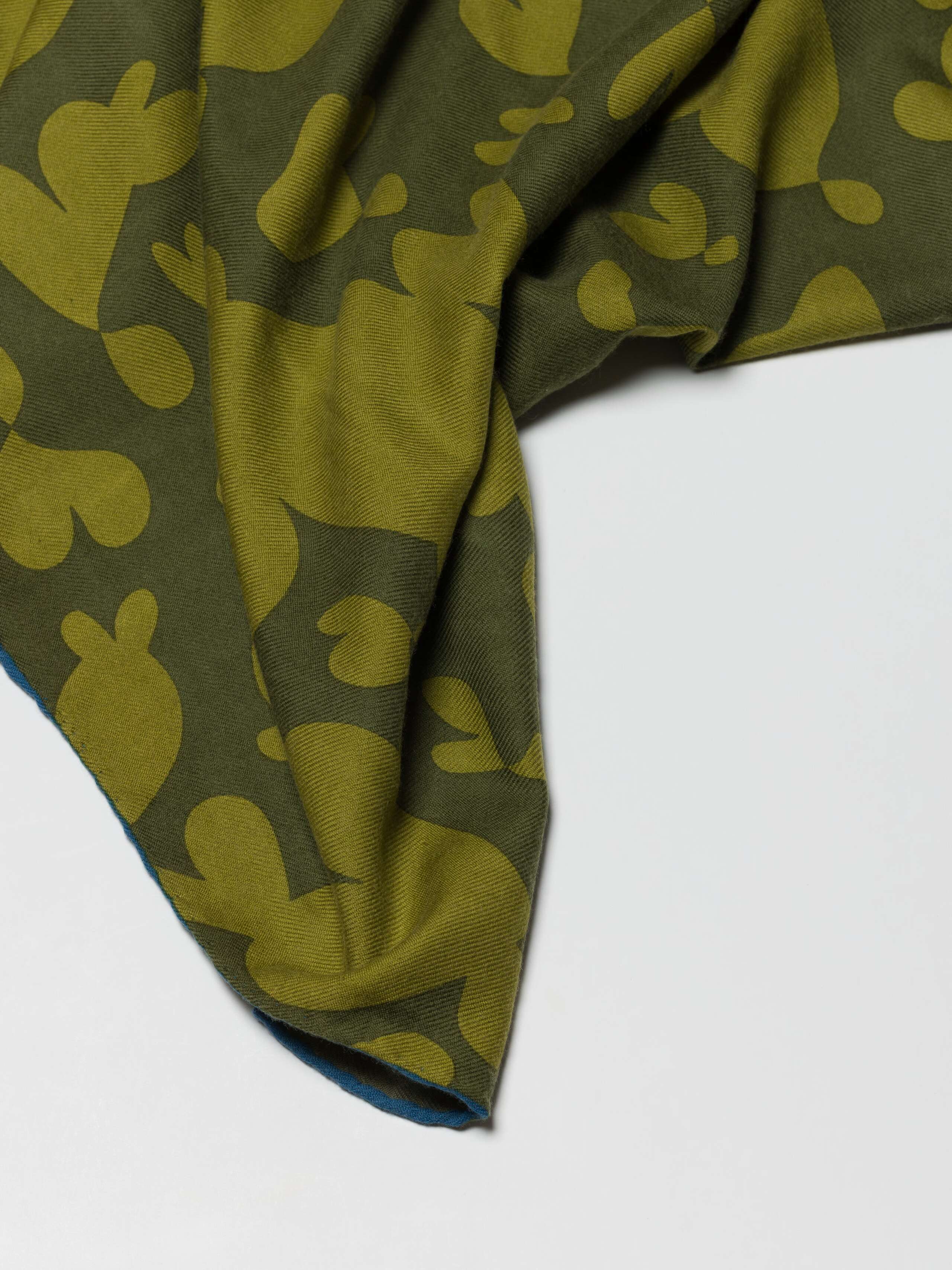 Detail shot of Monster Pattern Wool  Foulard in Peach-Teal