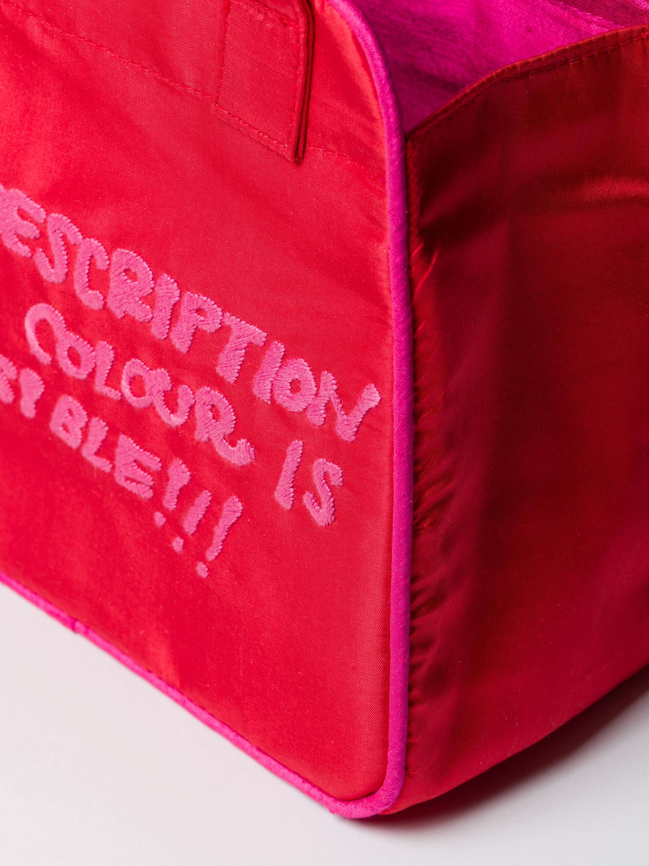 Detail Shot of Daisy Proverb Doupion Bag Description of a Color embroidery in Warmest Red
