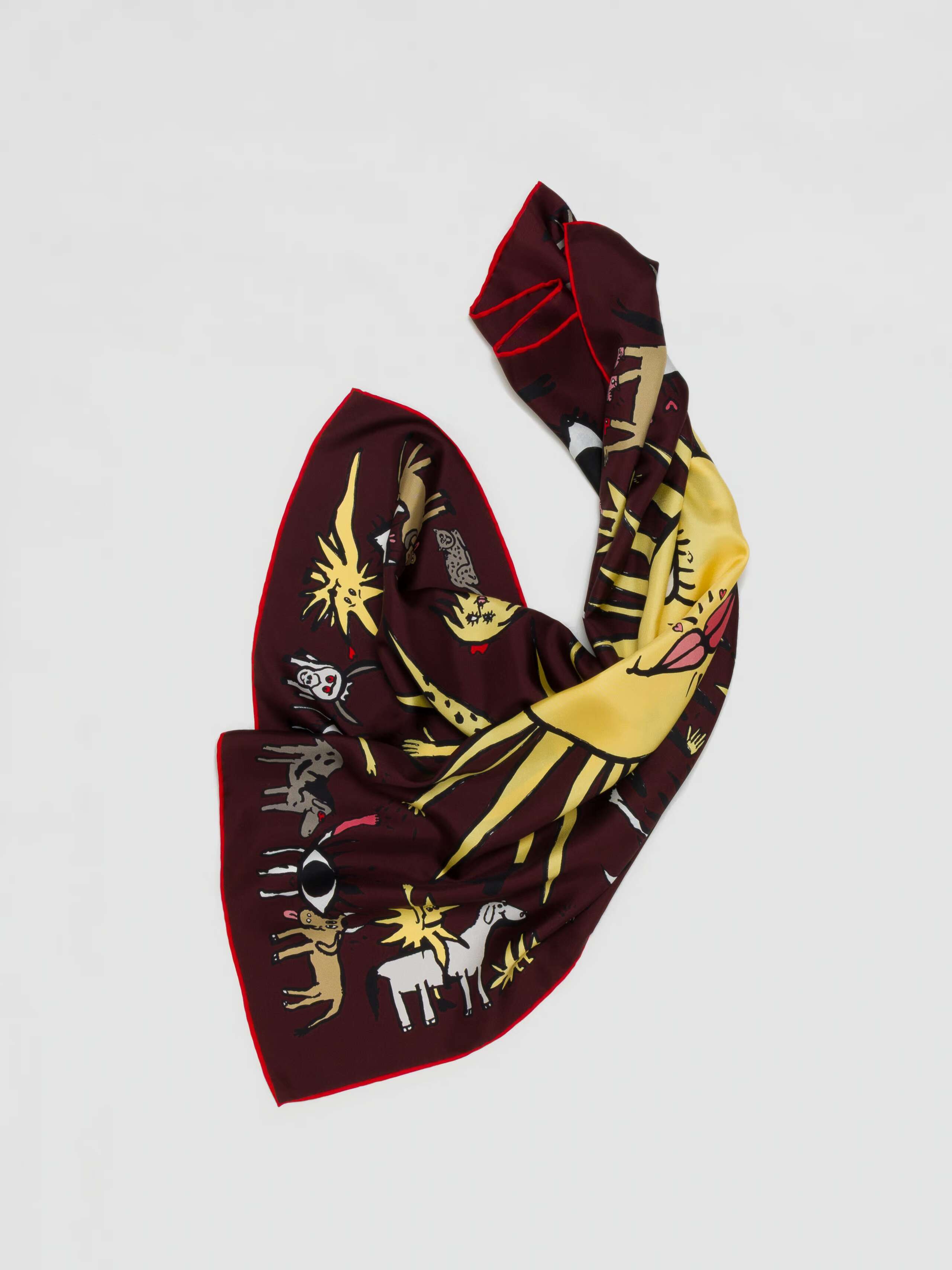 product detail shot of brown ojo de agua silk foulard scrunched up 