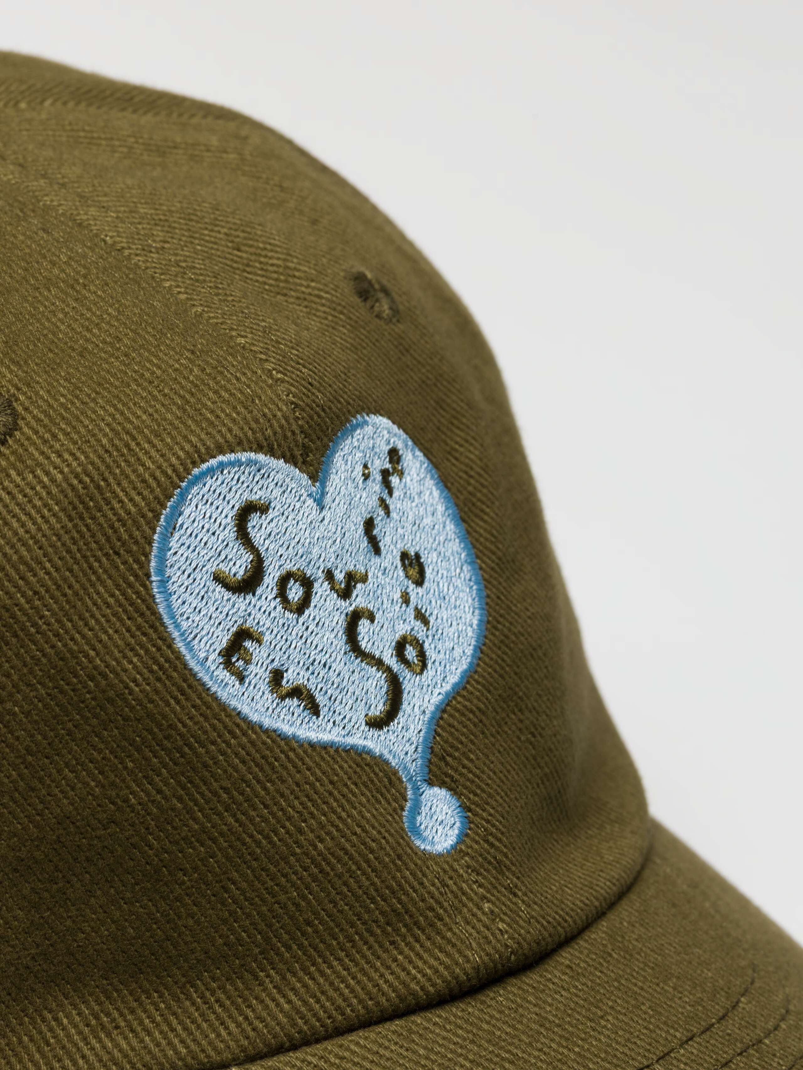 Detail of Tommy Hat Green with Blue Sourire Heart Embroidery