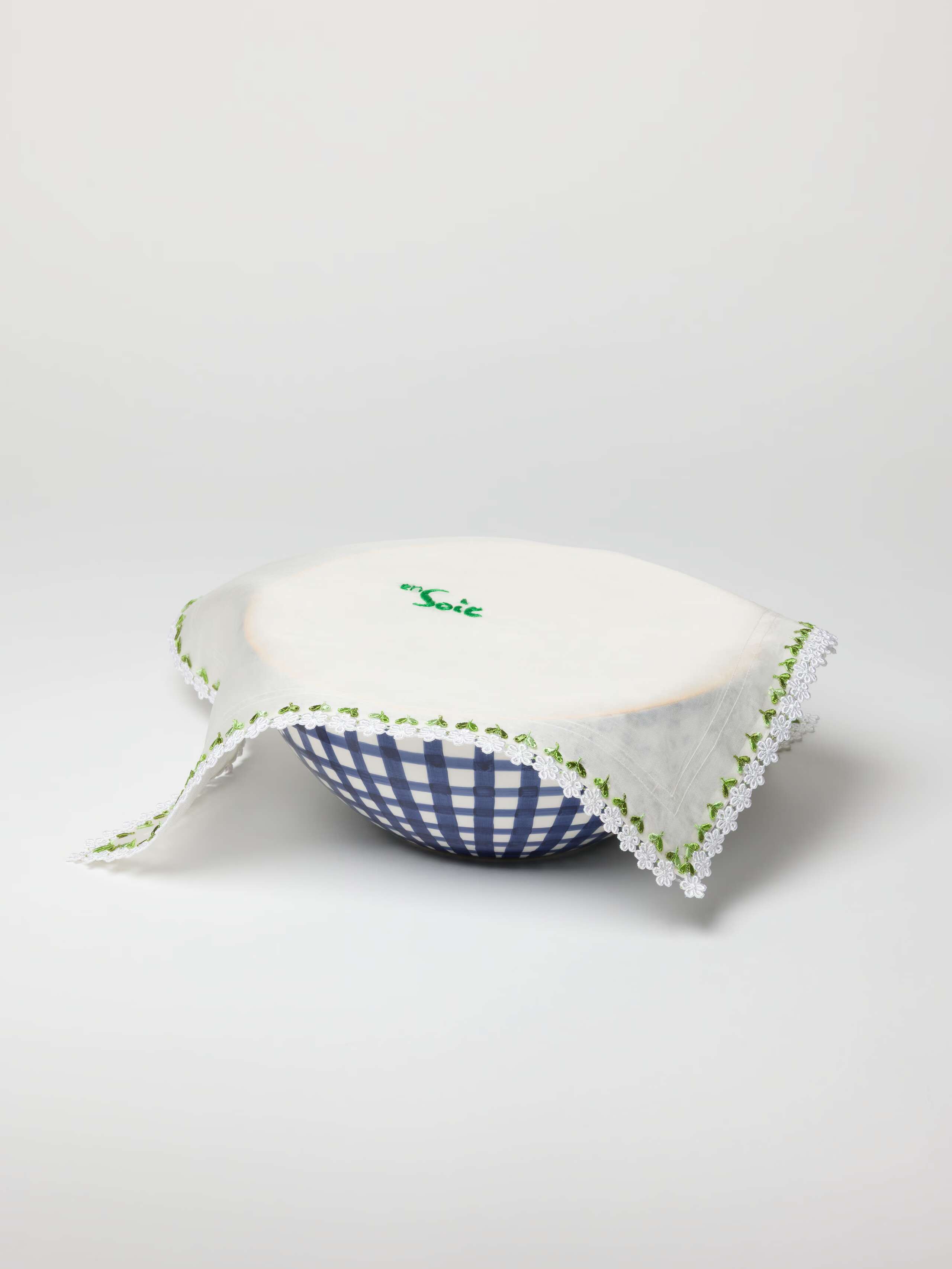 Bibi bowl cover made out of silk. edges hand embroidered with white flowers