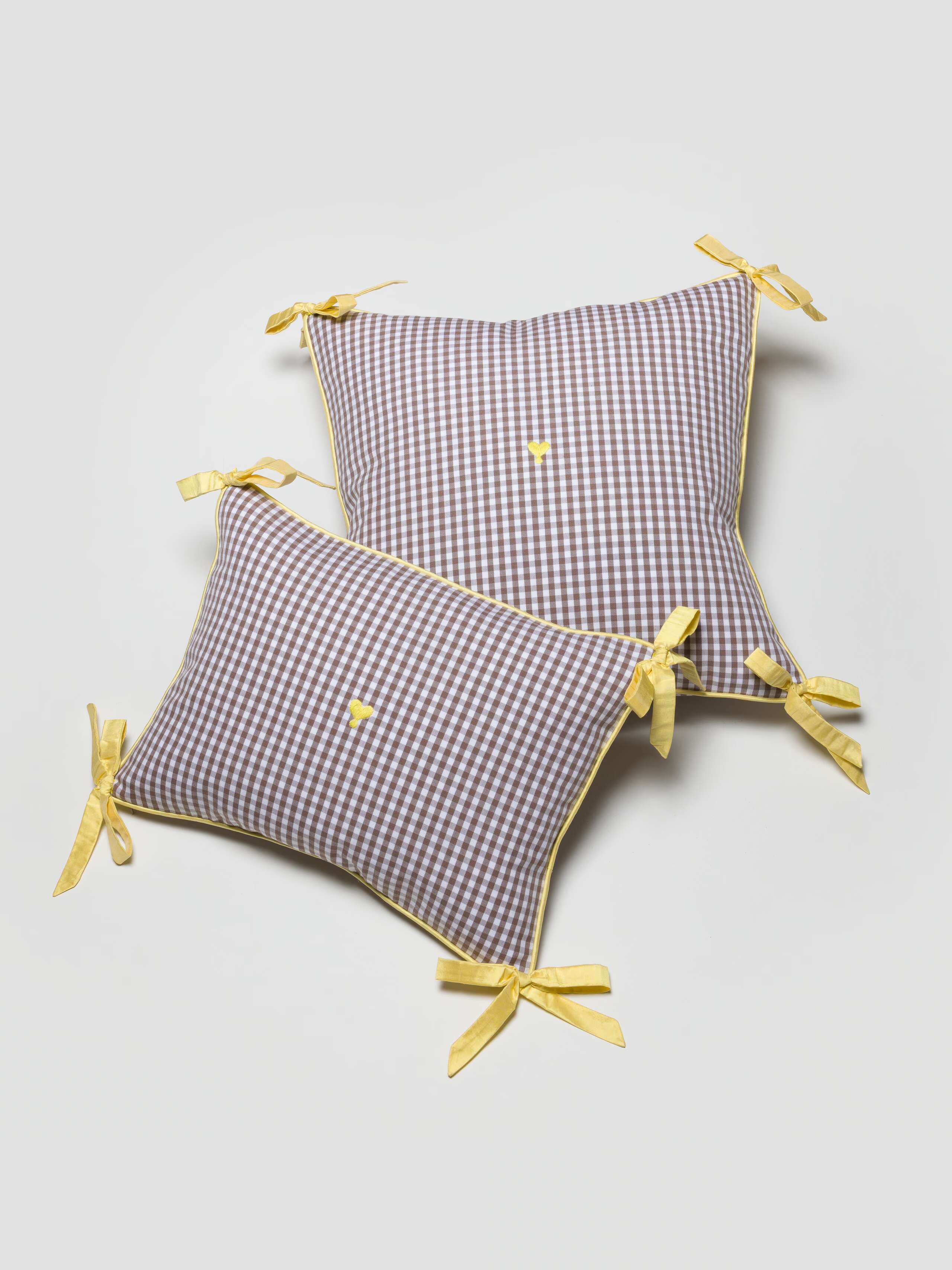 Mila and Milo pillow cover in Moonrock with yellow doupion ribbon