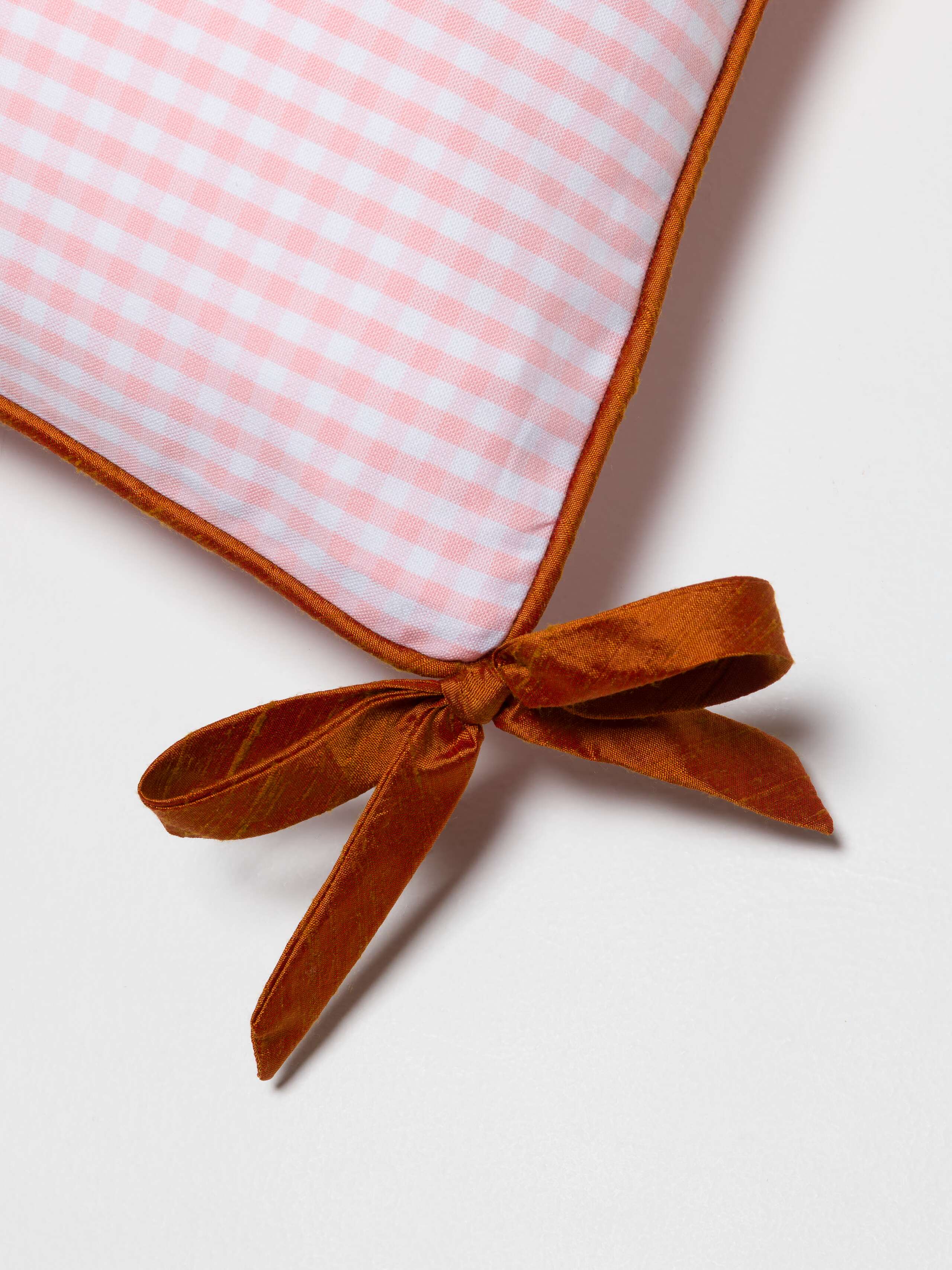 Pillow cover in Candy Pink with orange doupion ribbon