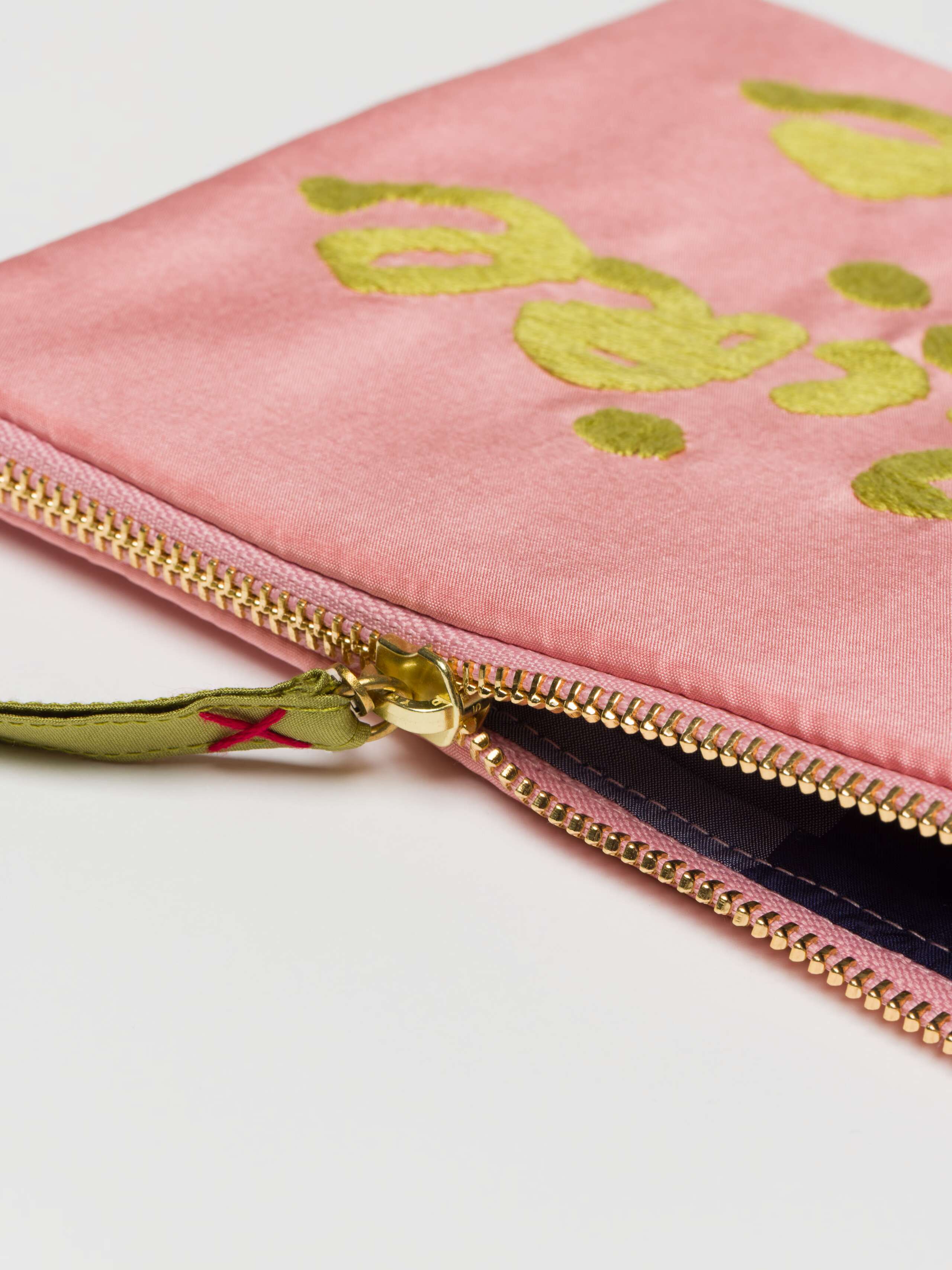 Detail shot of zipper of Proverb clutch in Fleur Rose