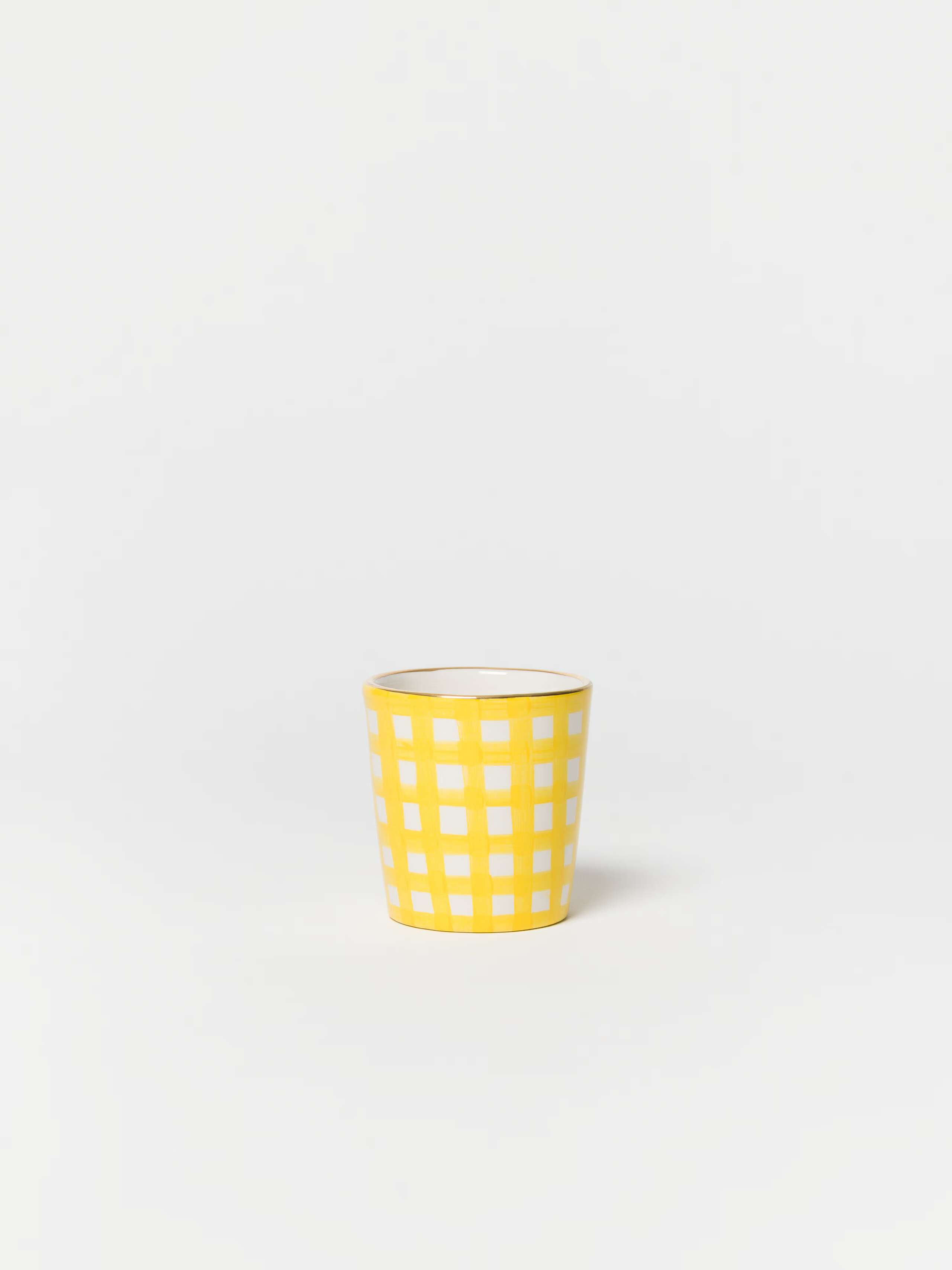 product shot of espresso cup in sunny yellow