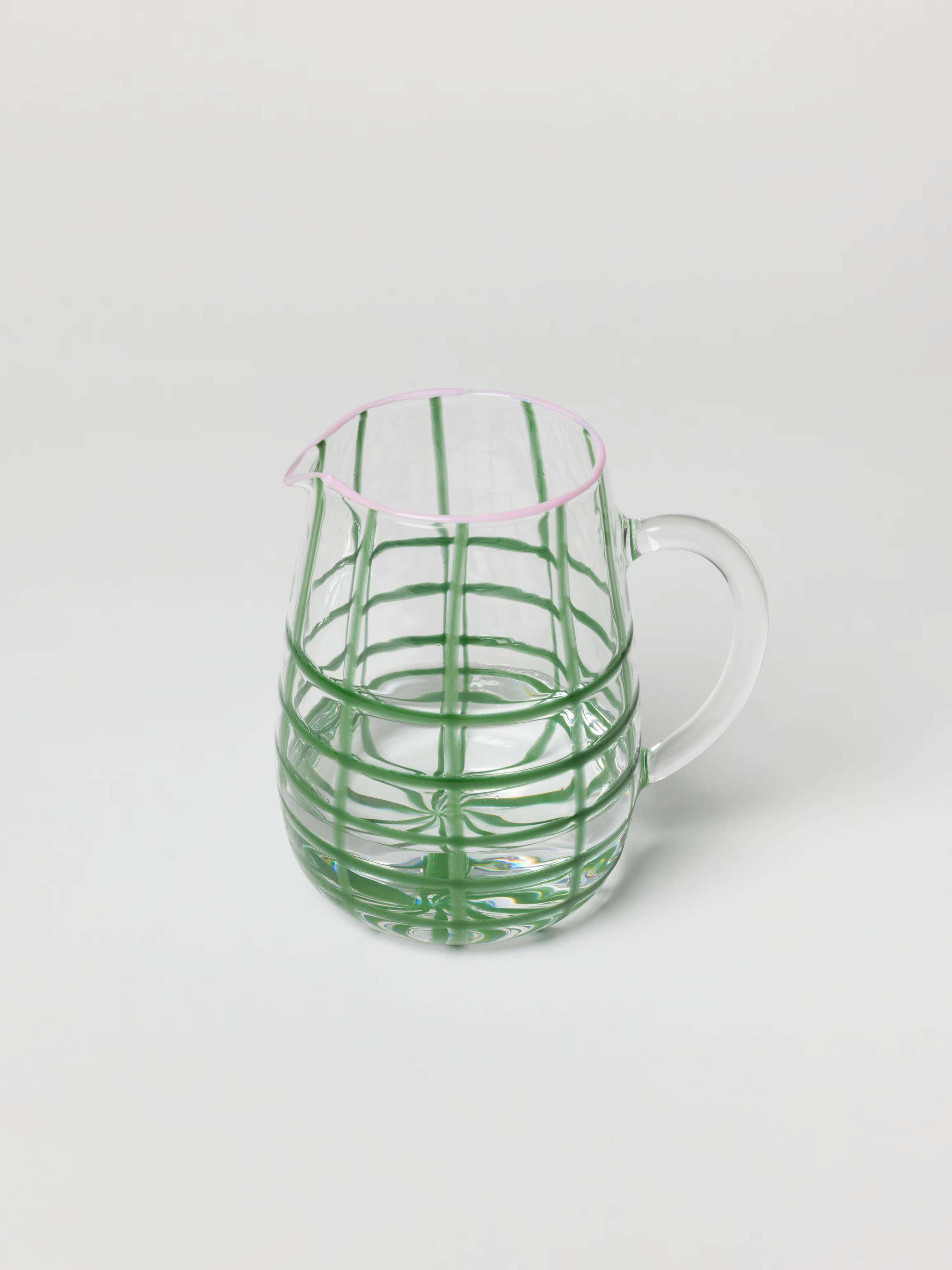 Glass jug in linden green with candy pink rim