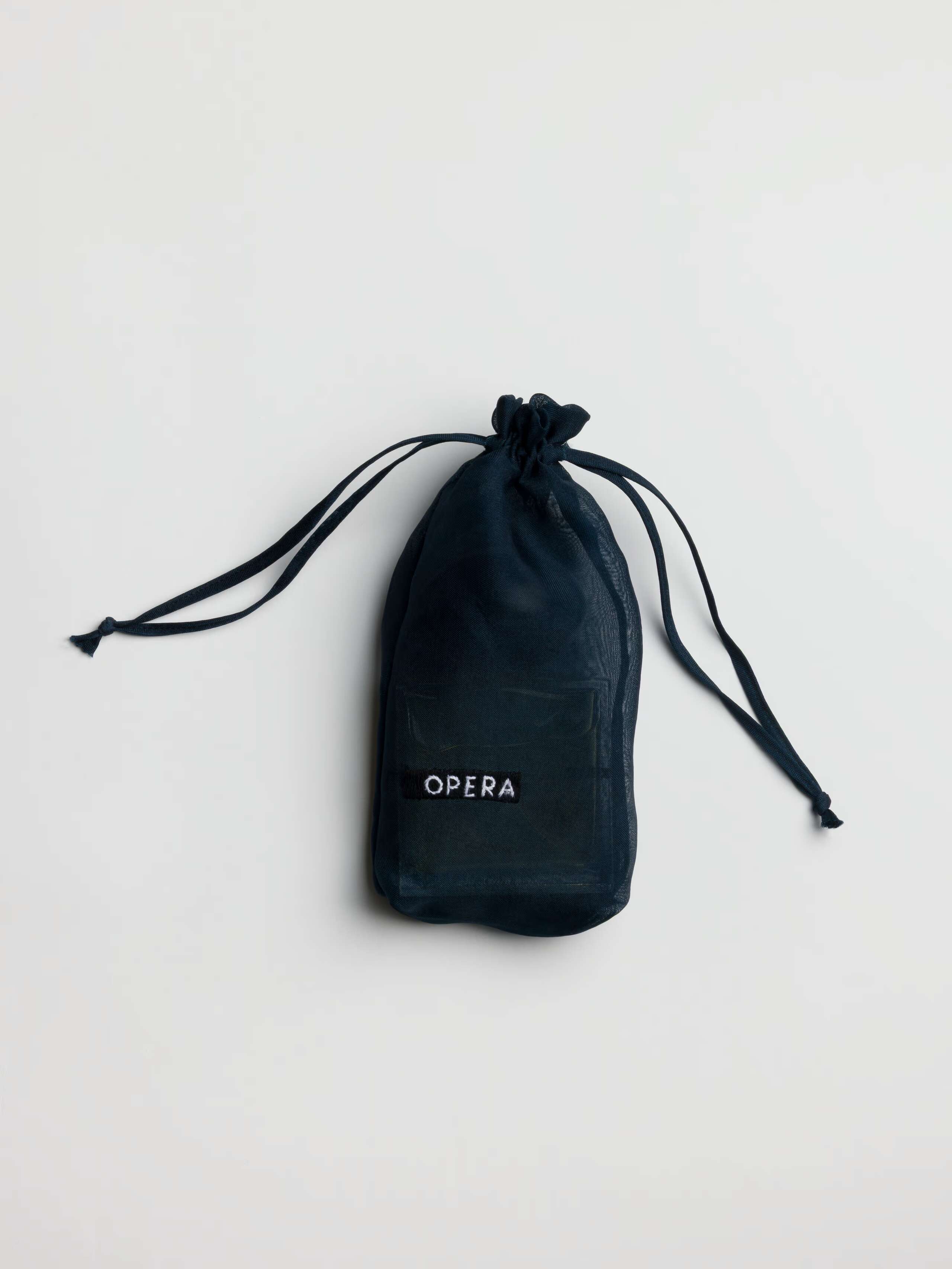 Product Shot of Opera Perfume Bottle in Bag 