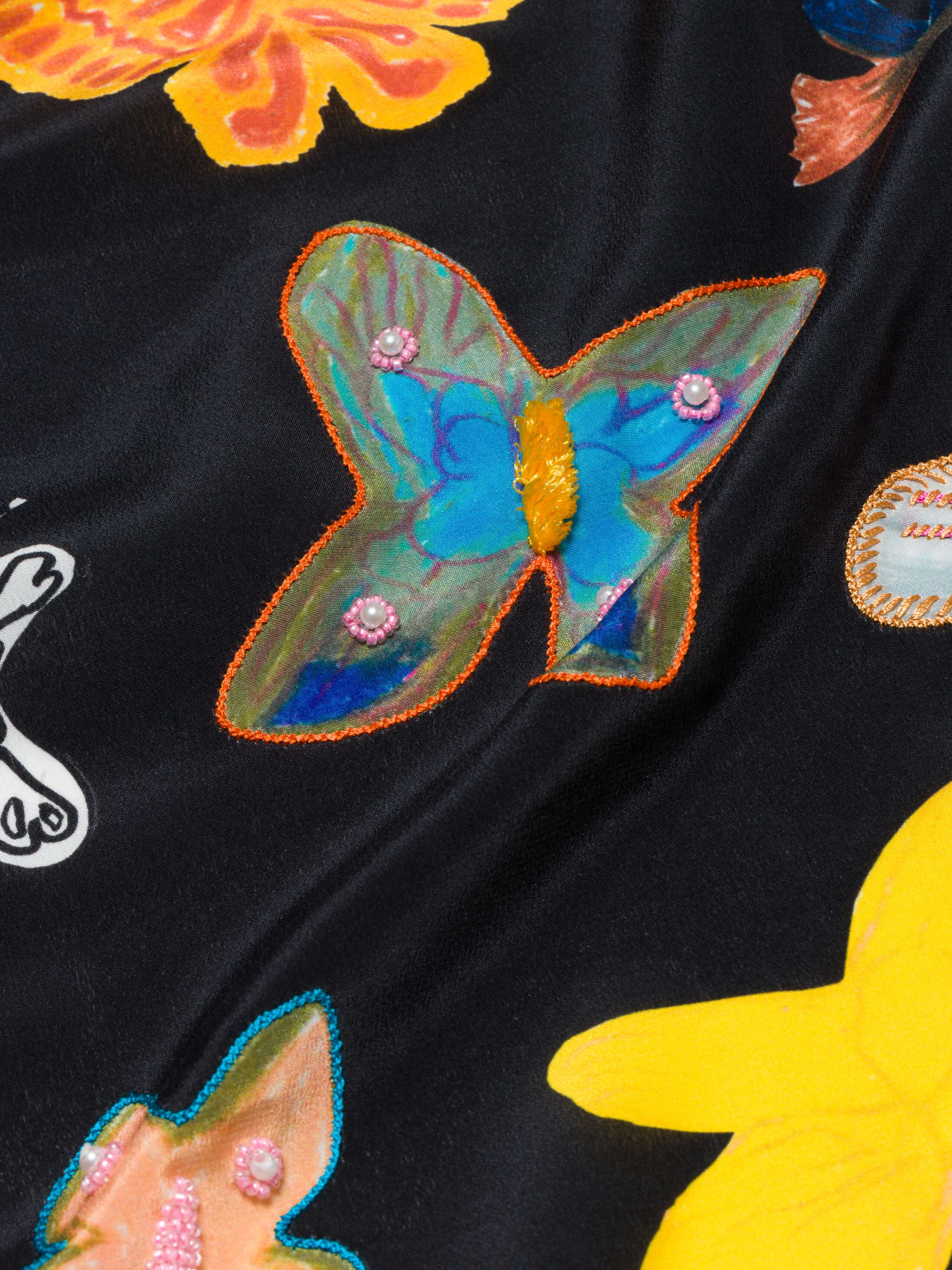 closeup shot of Carrie foulard butterfly and embroidery