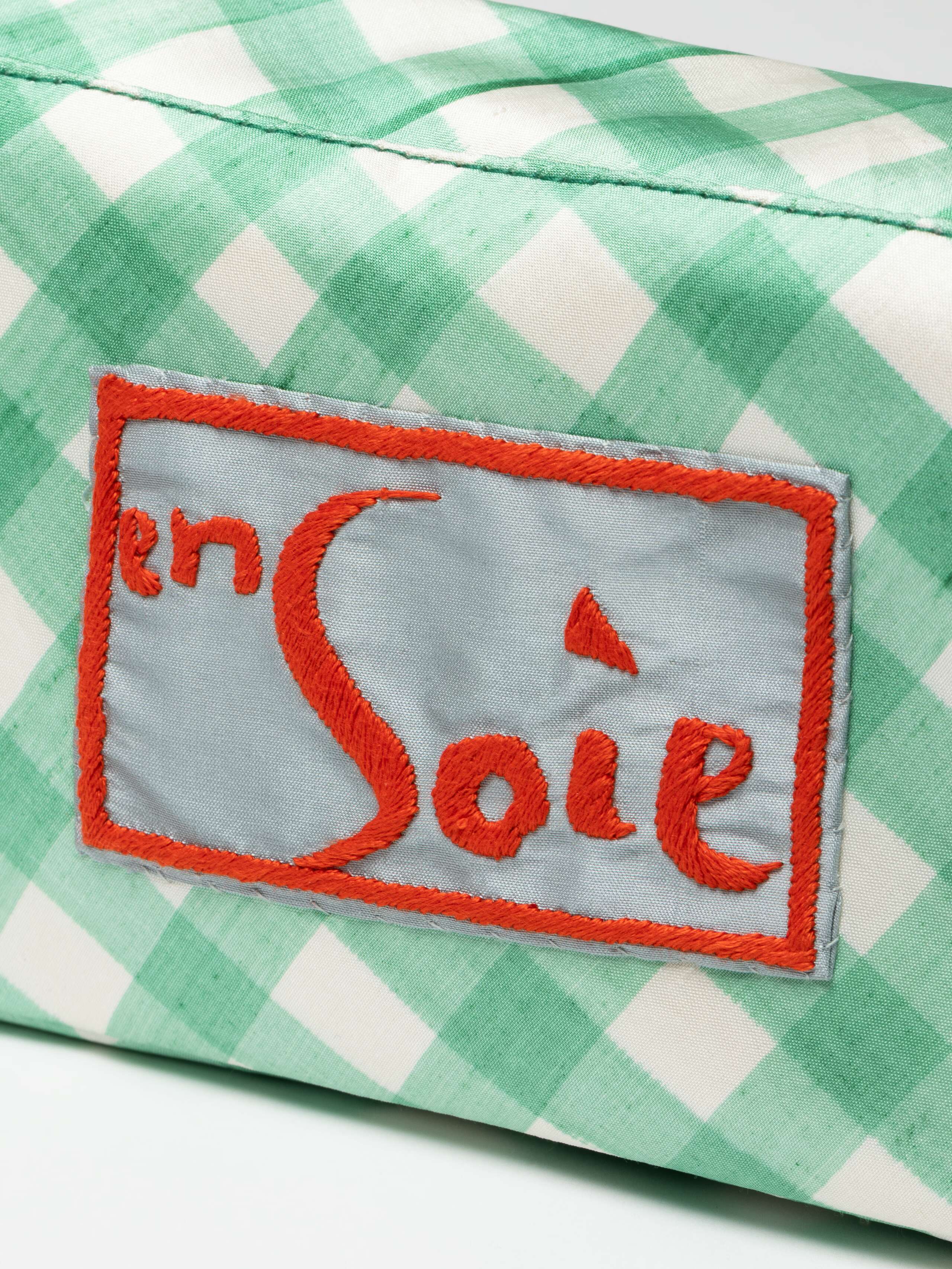 Detail Shot of Label on Edie Bag in Handpainted Vichy Green