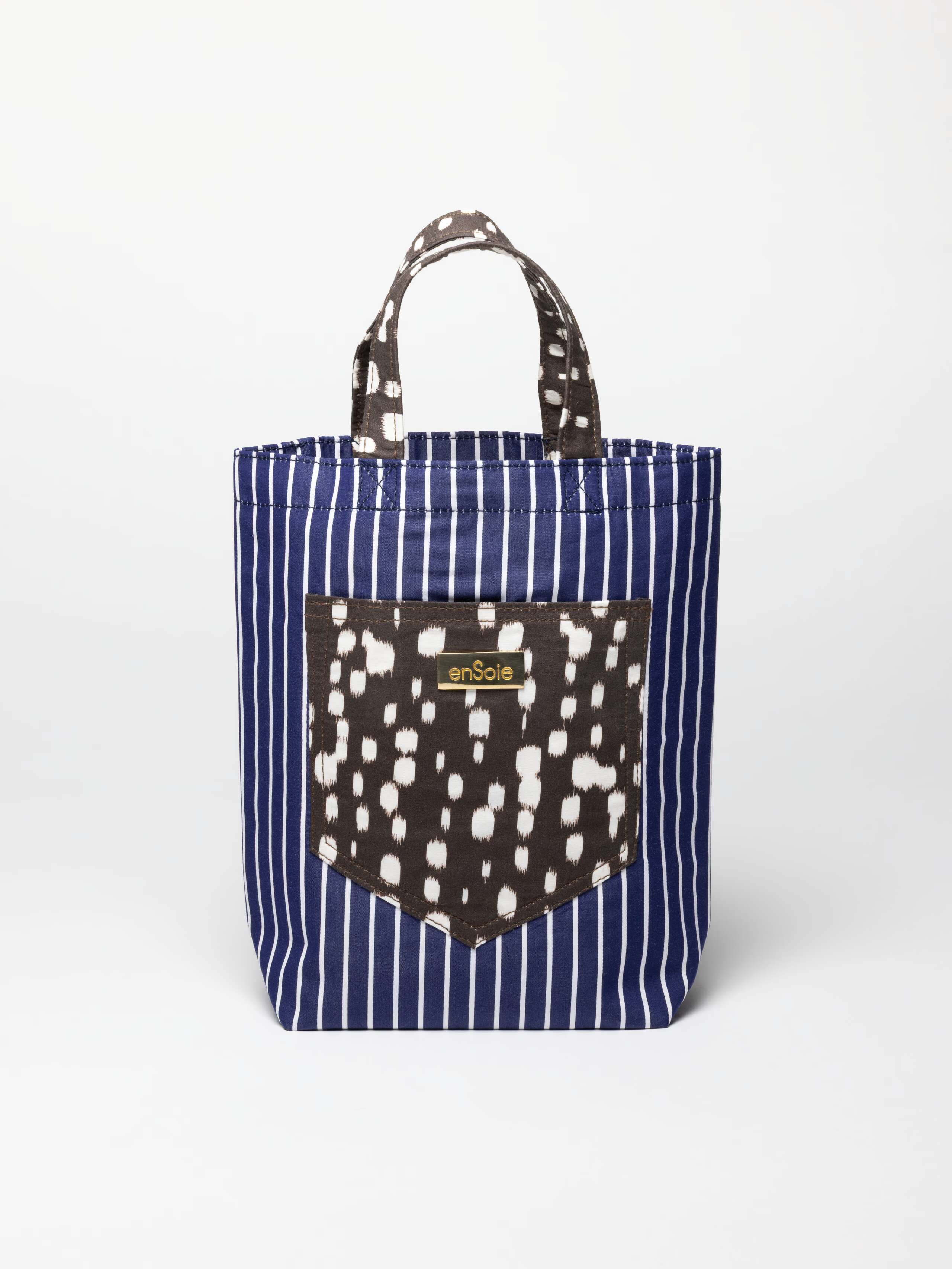 Product shot of June Bag in Navy Stripe with Bambi Dot accents 