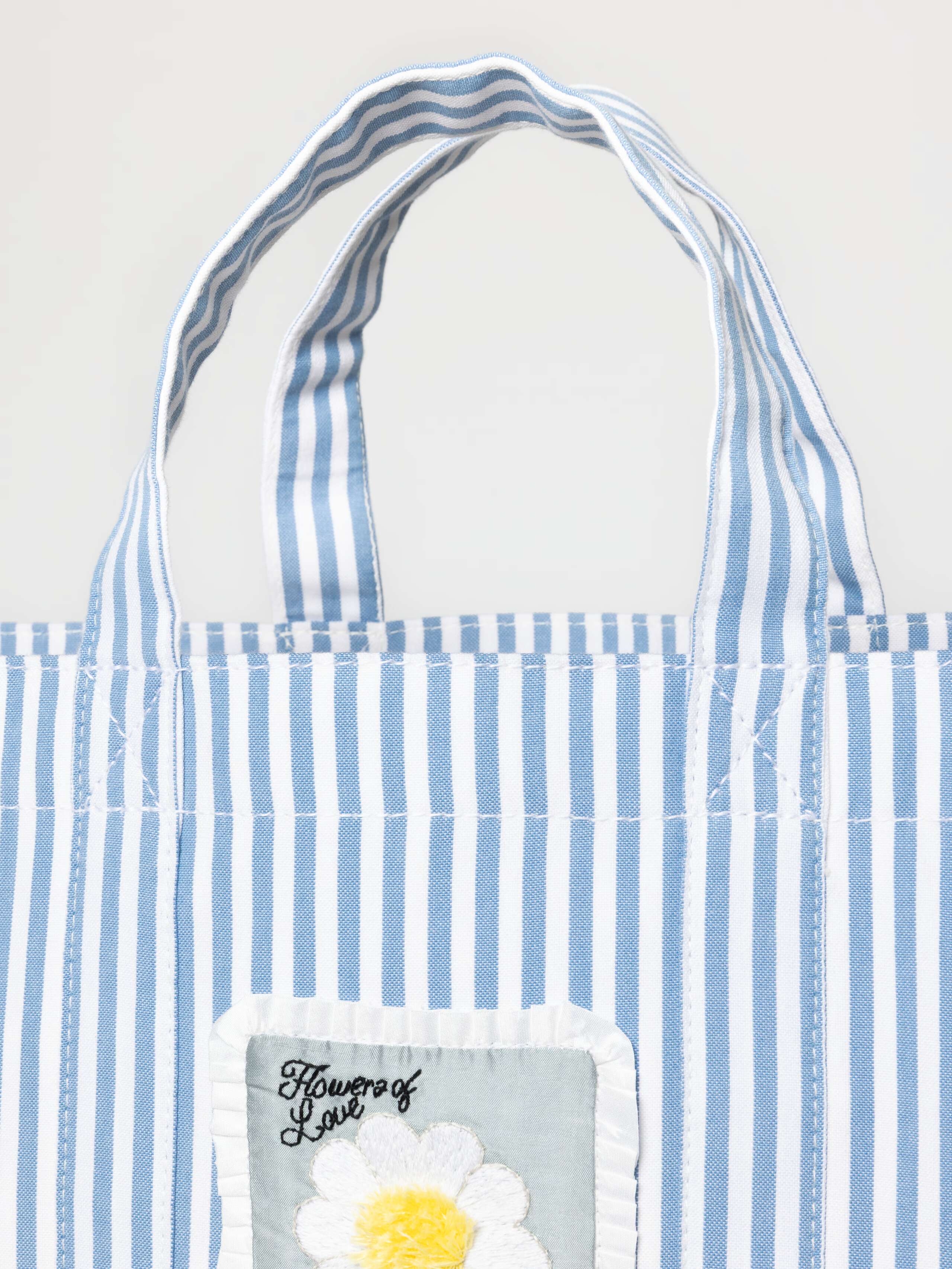 Detail Shot of Cabas Bag Striped in Cerulean Blue with Mothers Day Label