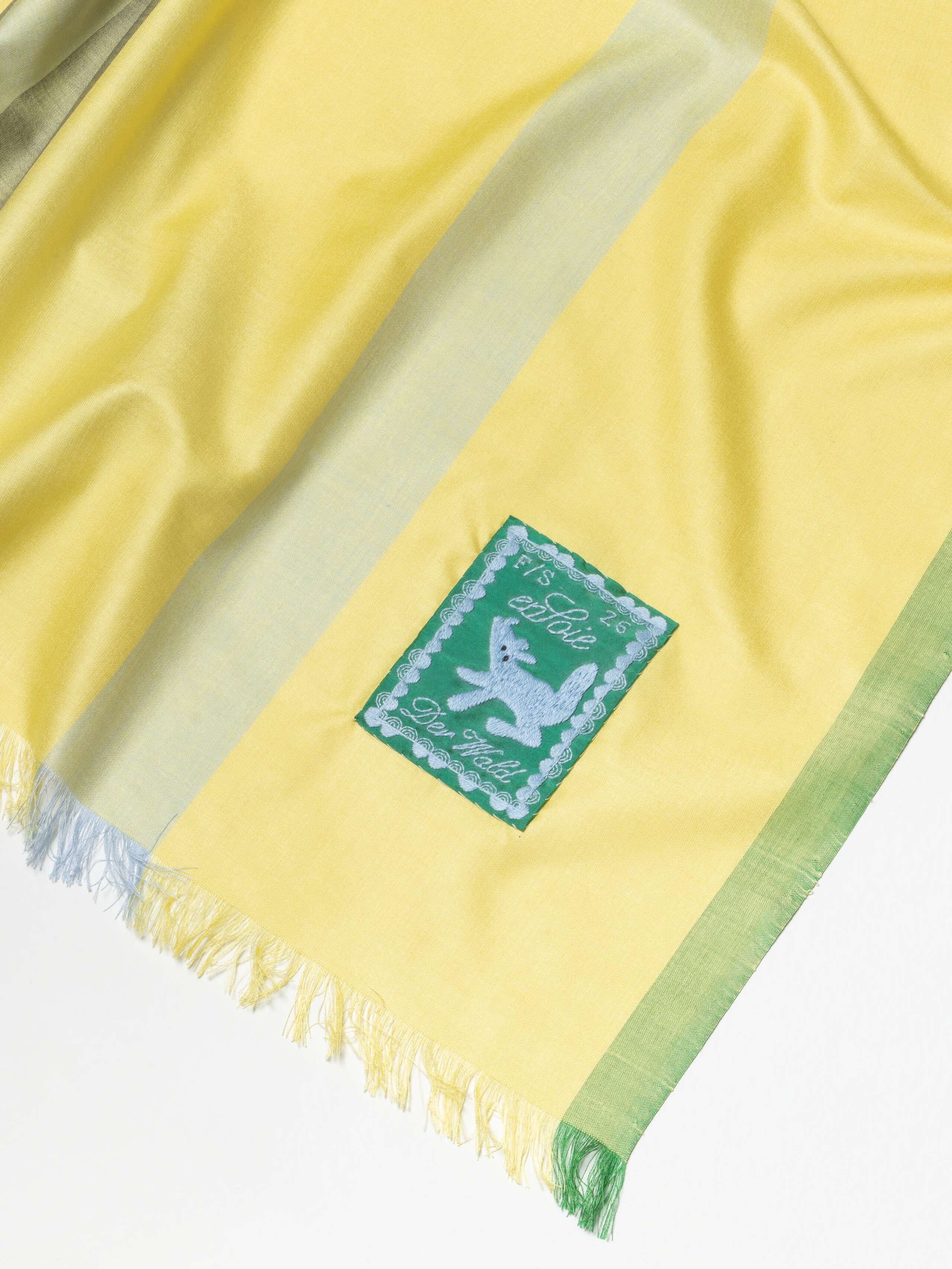 detail shot of label for Satu Scarf 160 in Forget Me Not 
